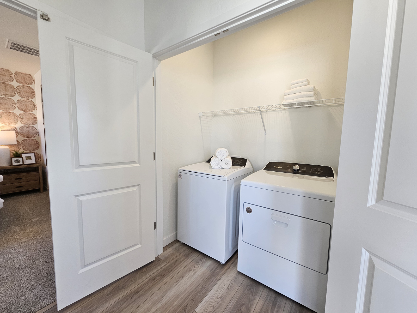 A small kitchen with white cabinets.
