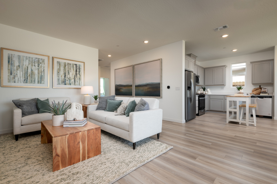 A living room with a wood floor.