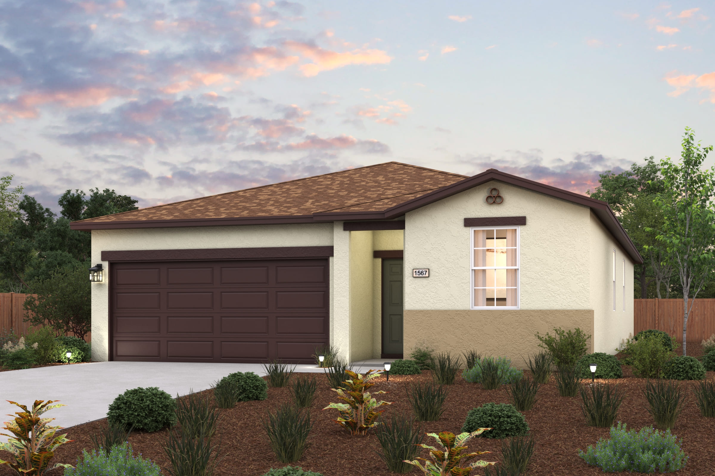 A house with a garage and bushes.