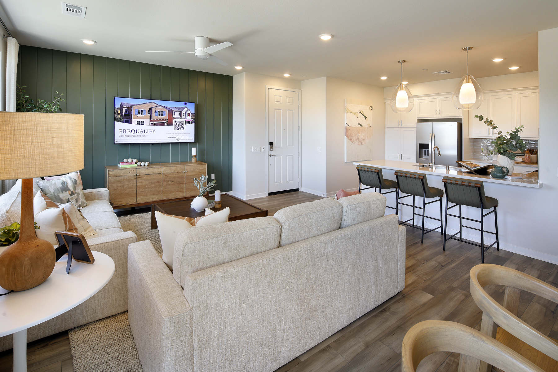 A living room with a couch and chairs.