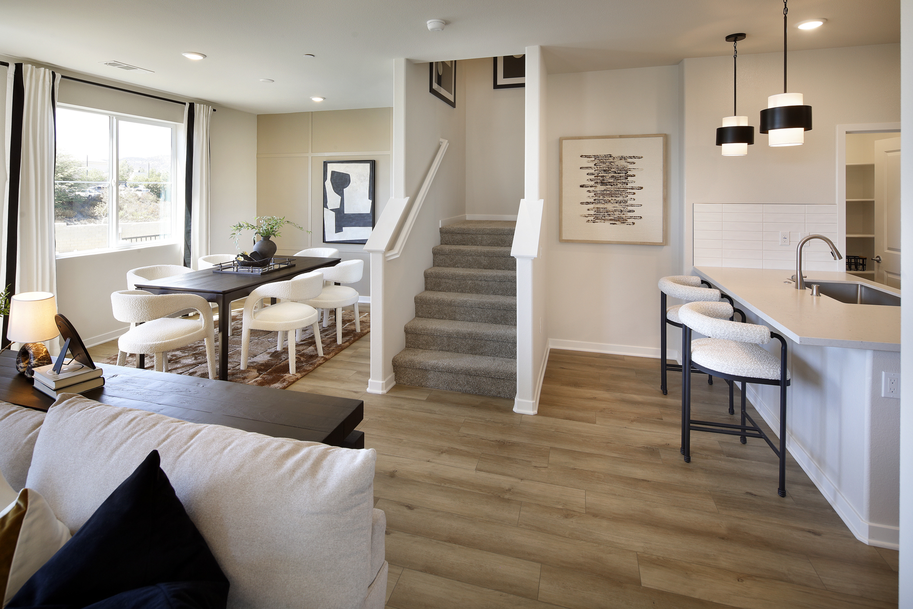 A large living room with a wood floor and a wood floor.