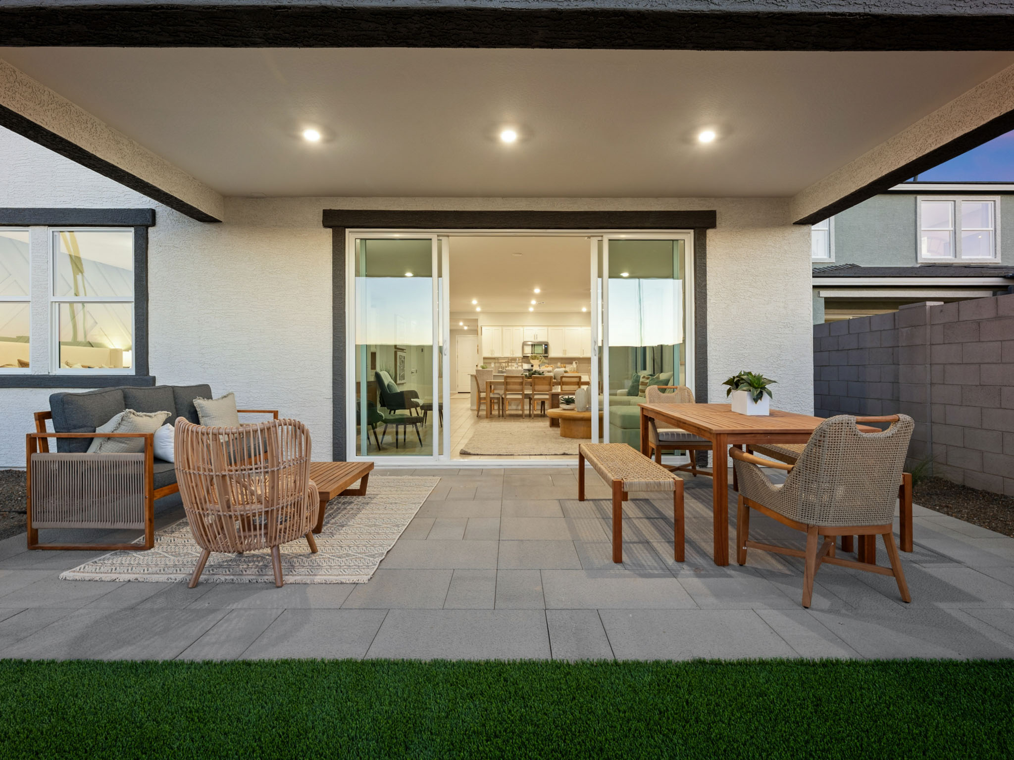A room with a table chairs and a couch.
