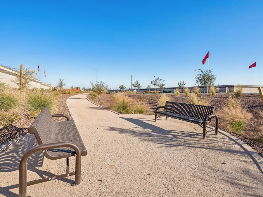 Benches on a sidewalk.