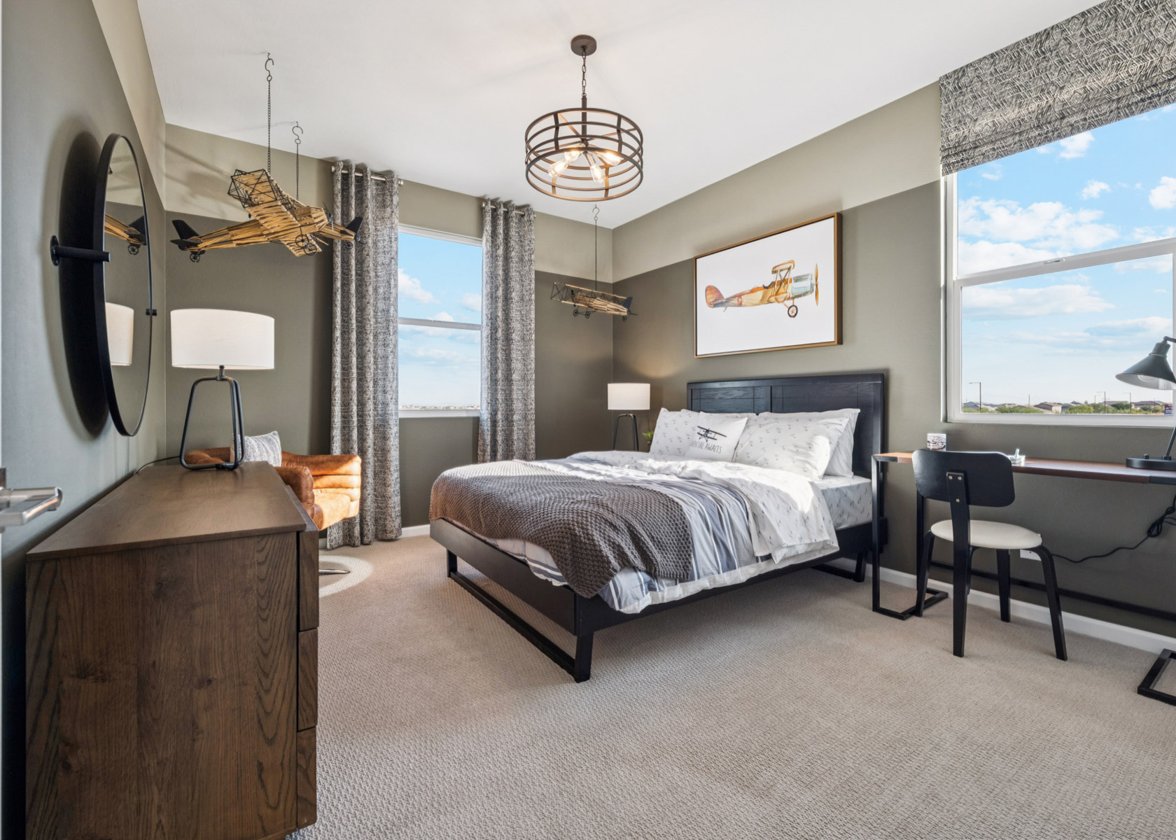 A bedroom with a large window.