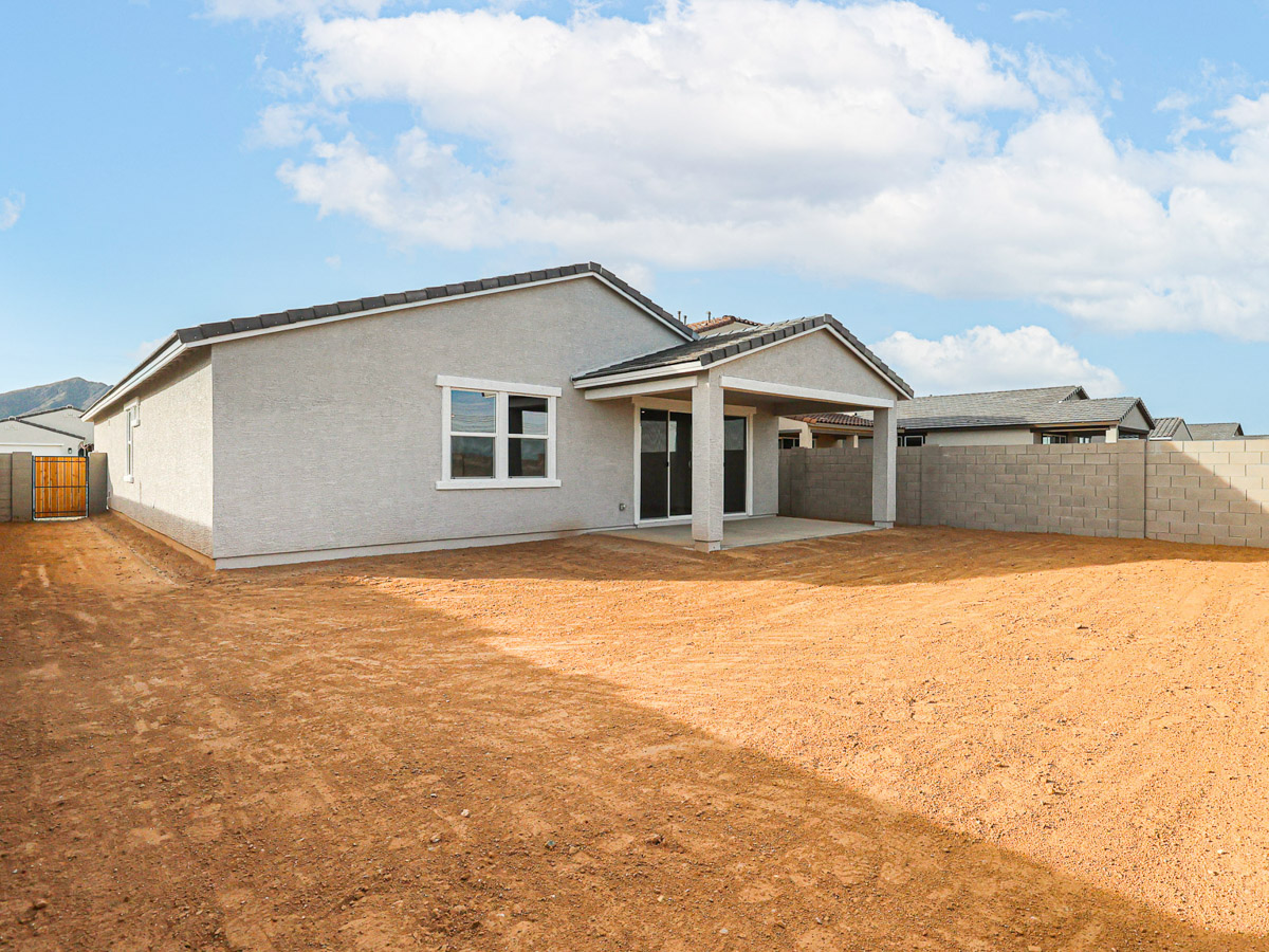 A house with a dirt yard.