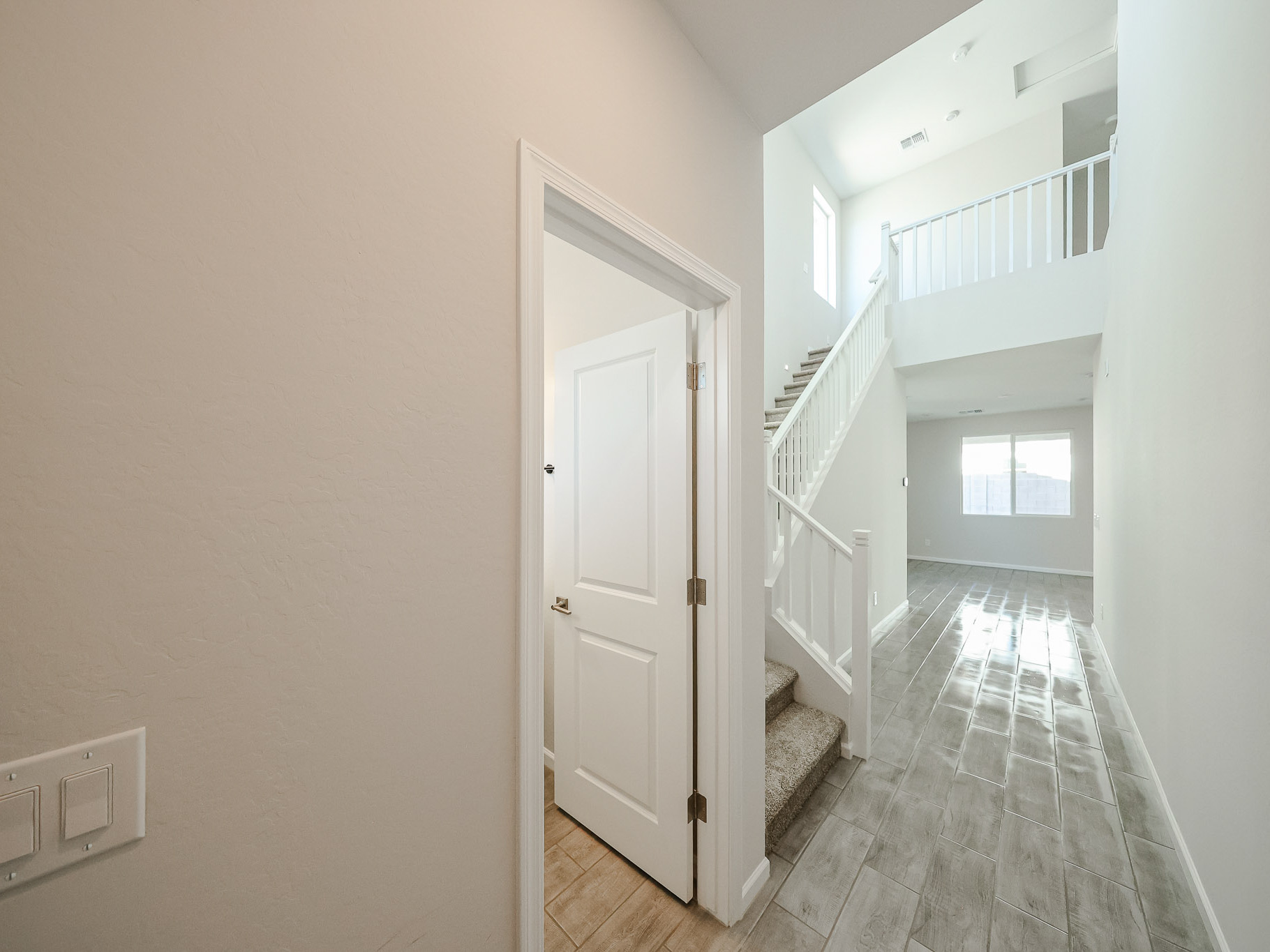 A hallway with white doors.