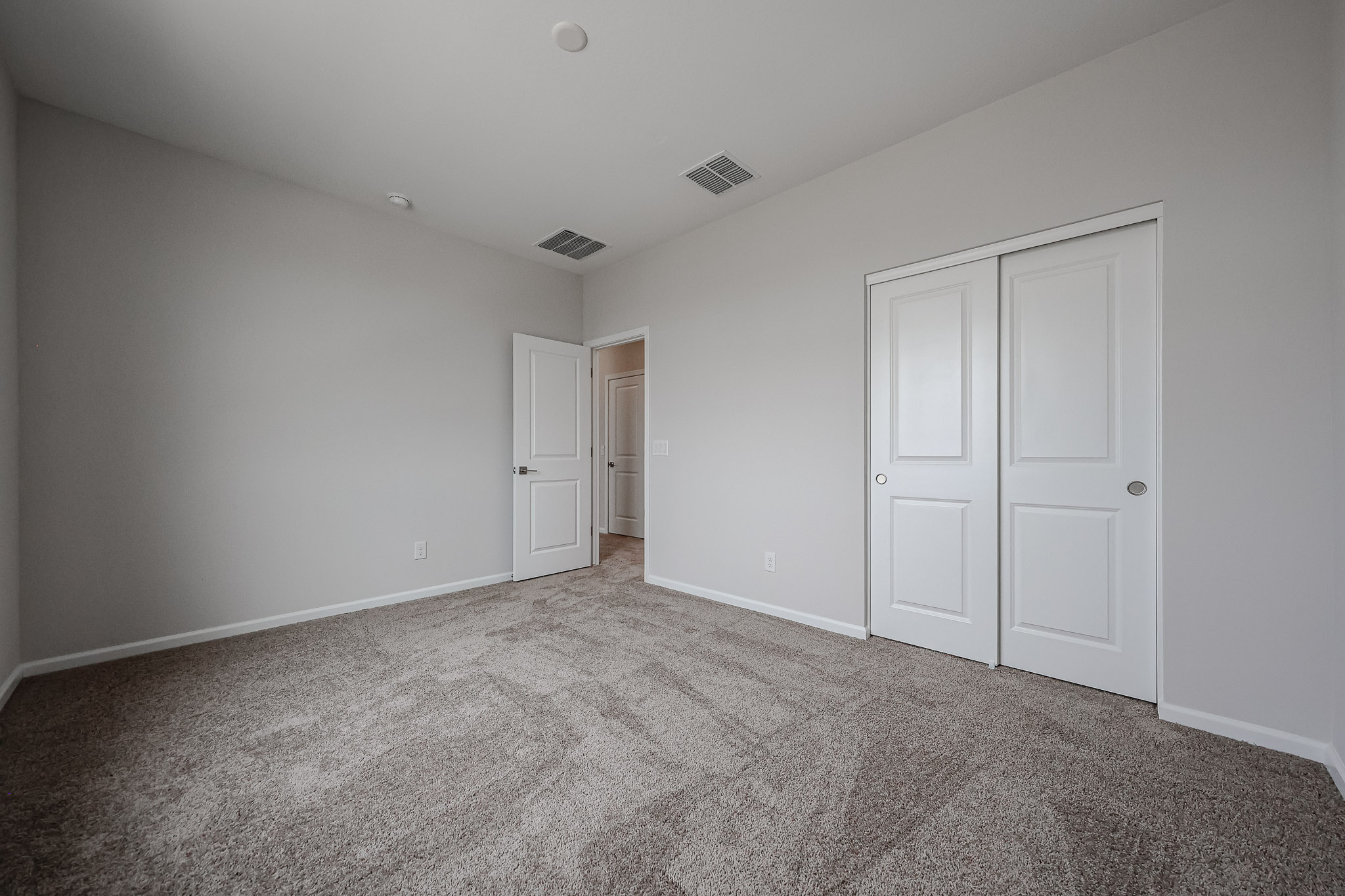 A room with white doors.