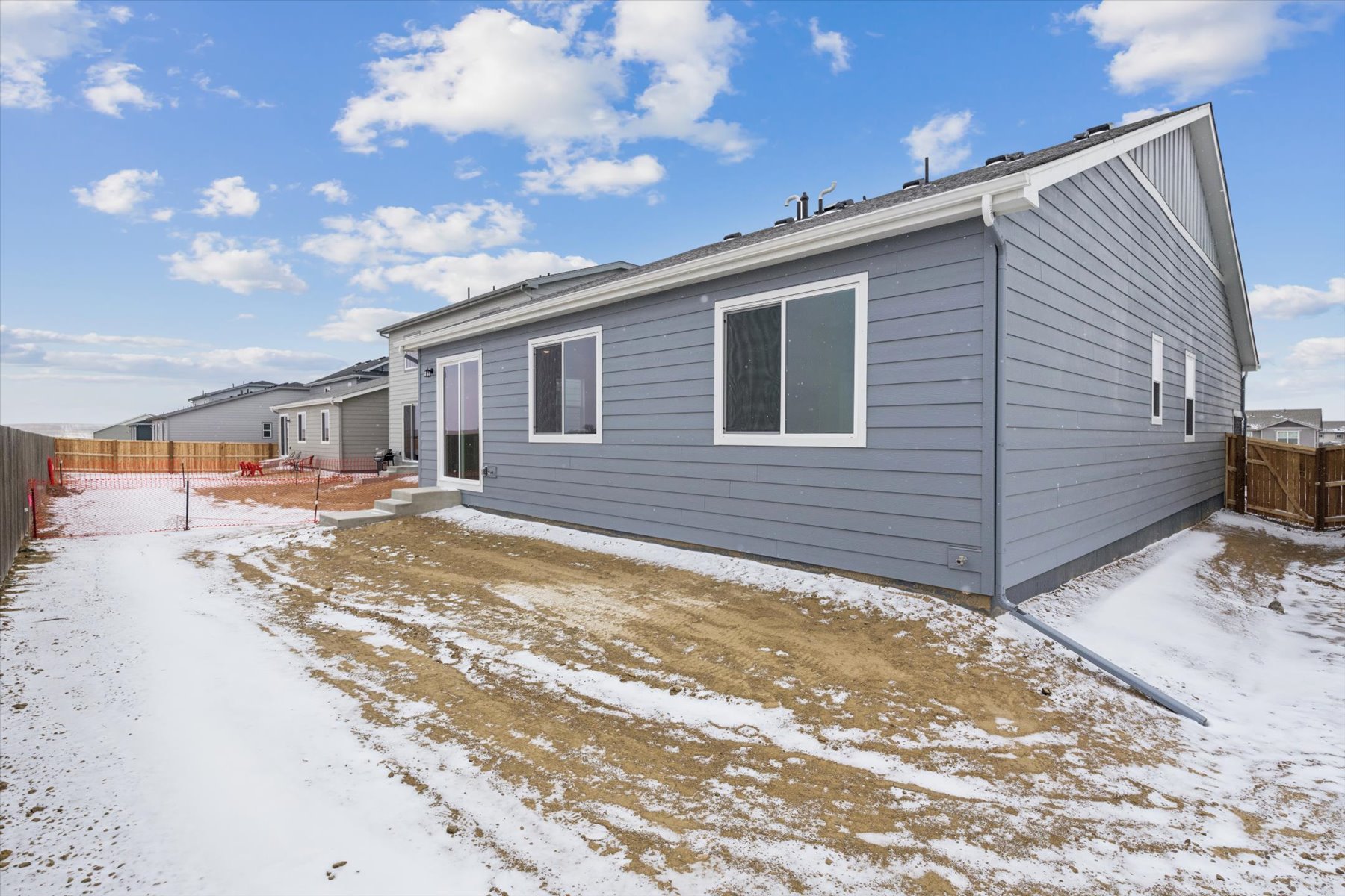 A house with a snowy yard.