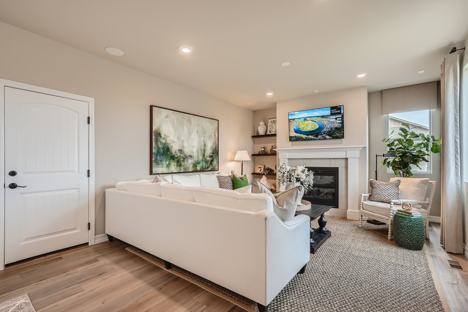 A large living room with a fireplace.