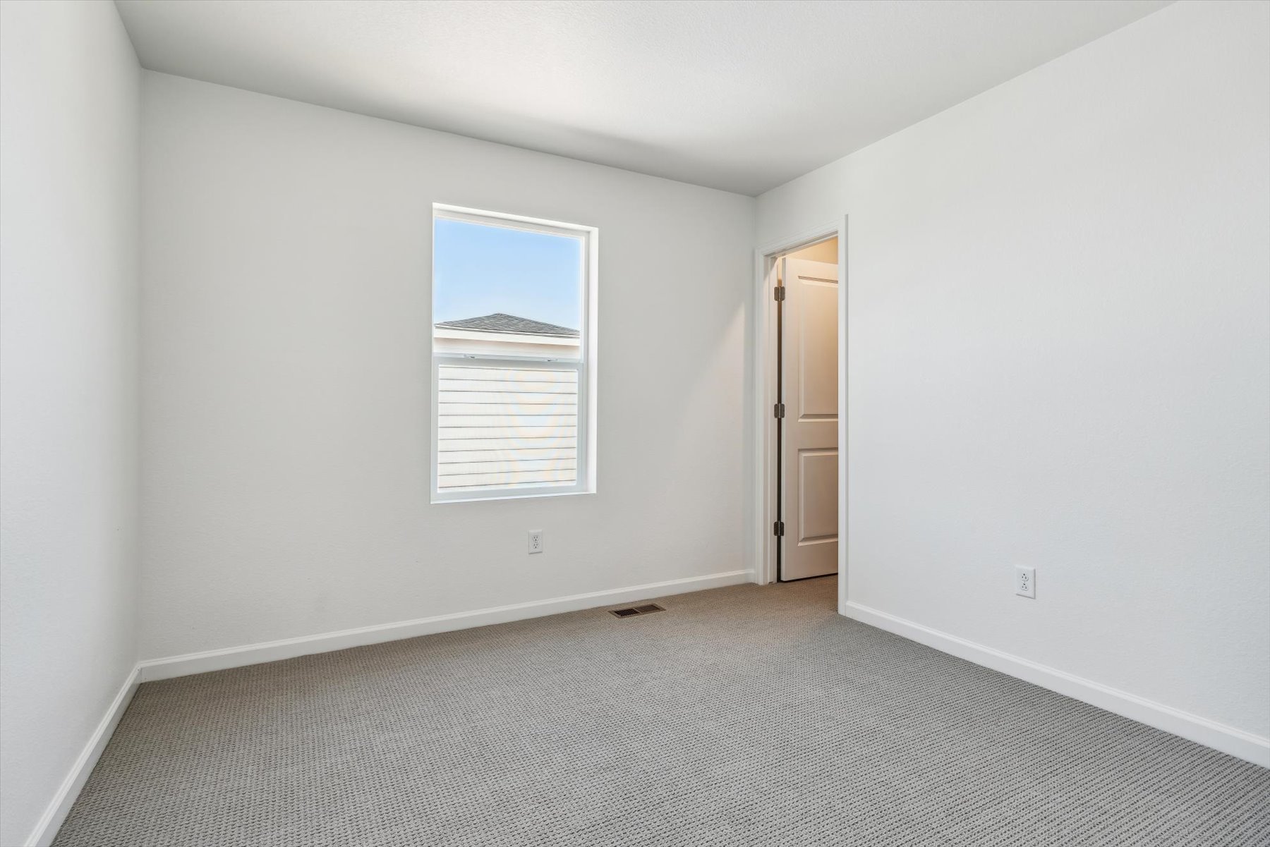 A room with a door and a window.