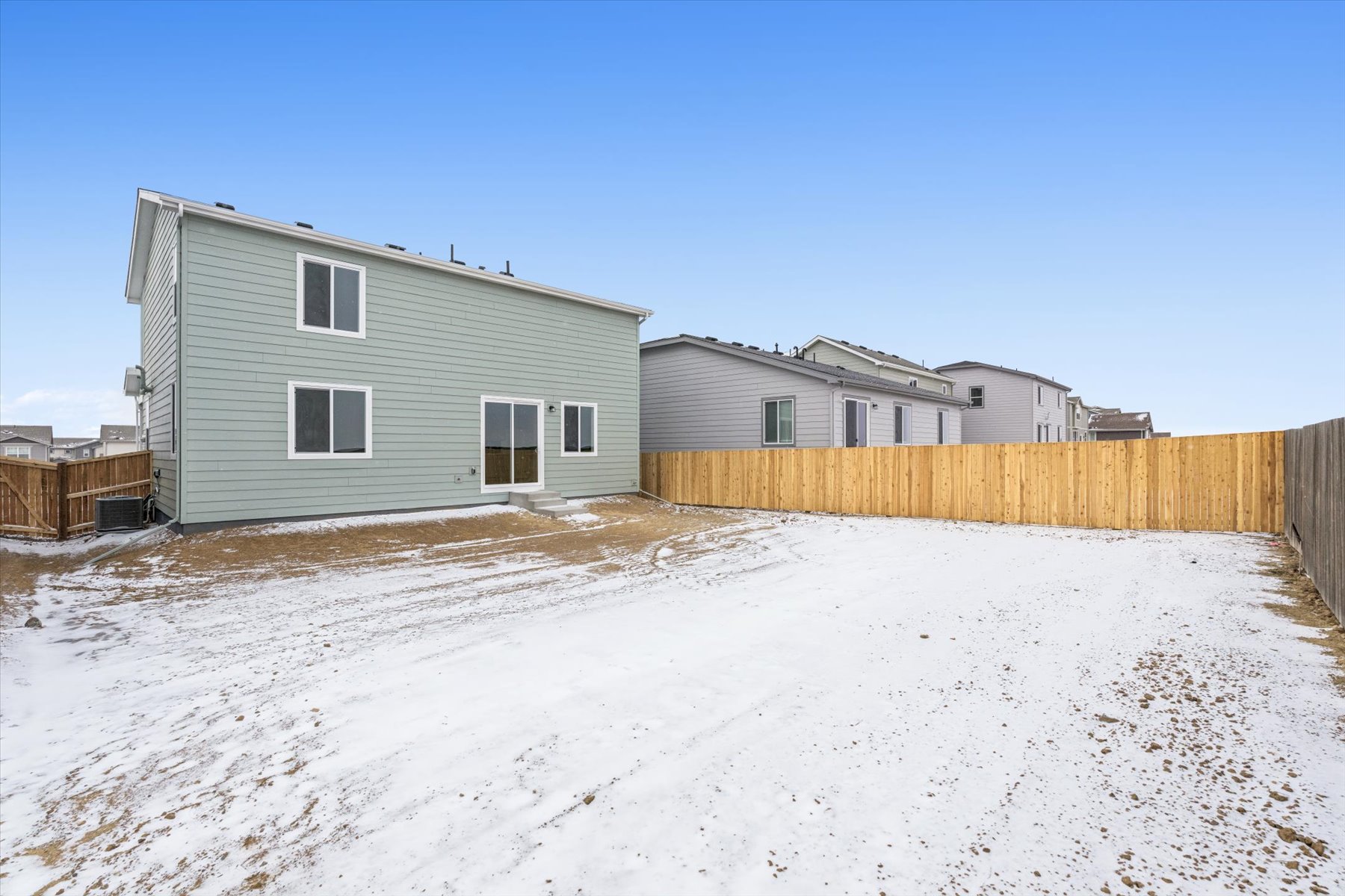 A row of houses in a snowy area.