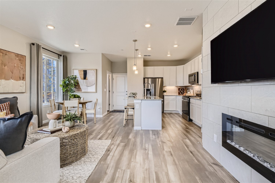 A living room with a wood floor.