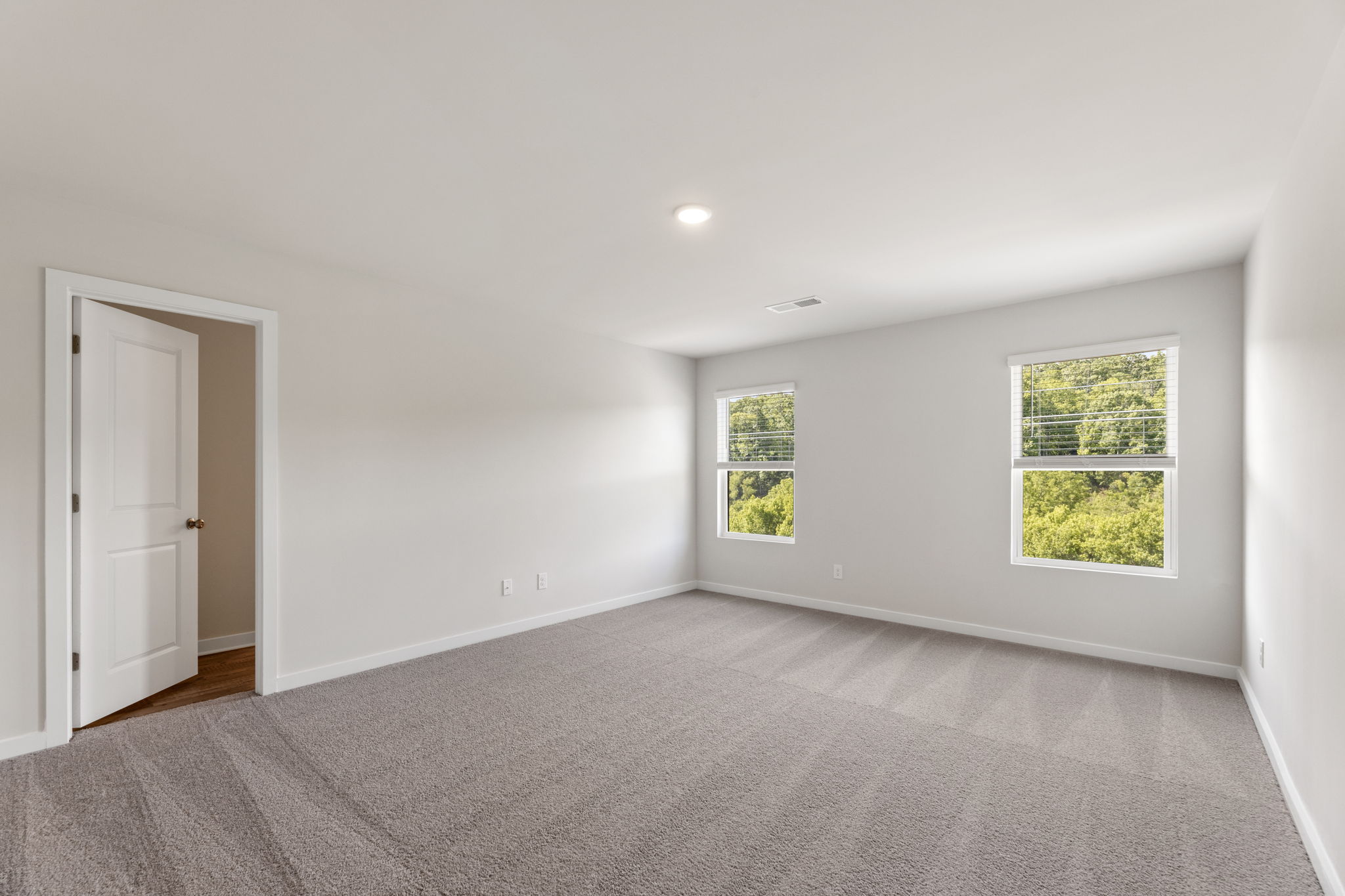 A room with a door and windows.