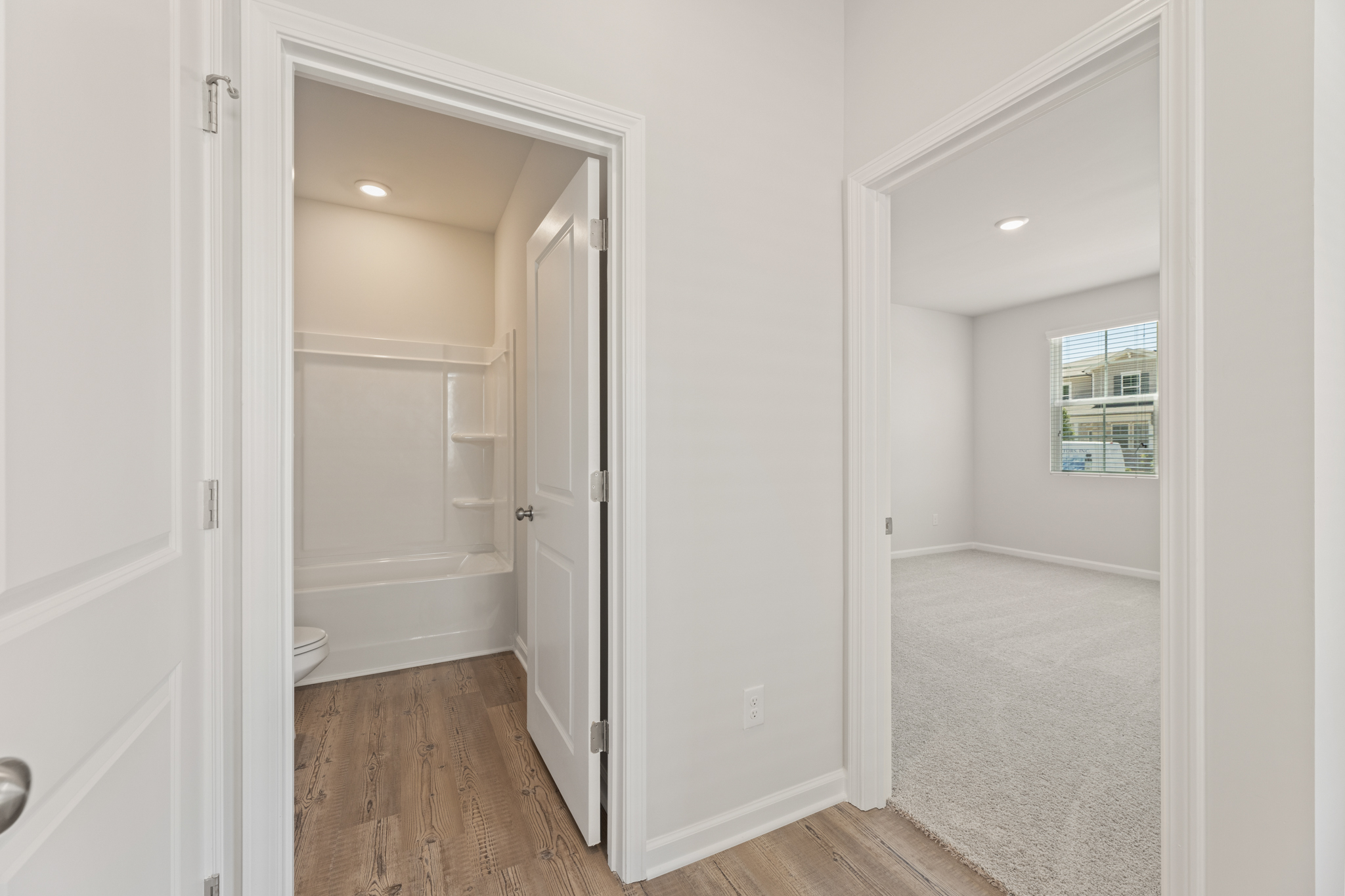 A bathroom with a shower and a toilet.