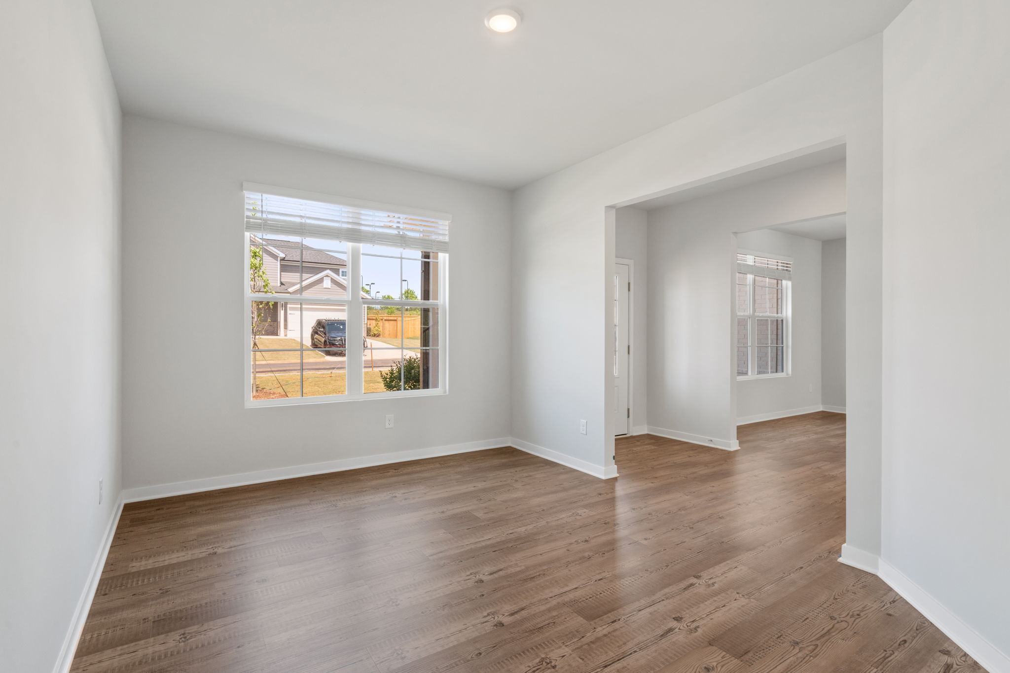 A room with a wood floor and a wood floor.