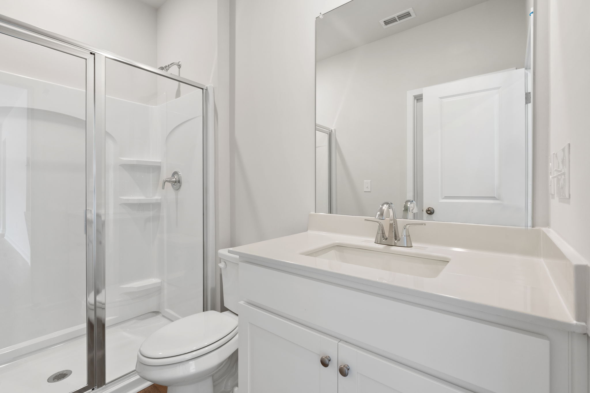 A bathroom with a glass shower.