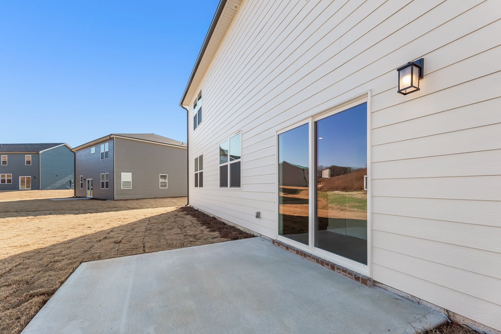 A white building with a glass door.