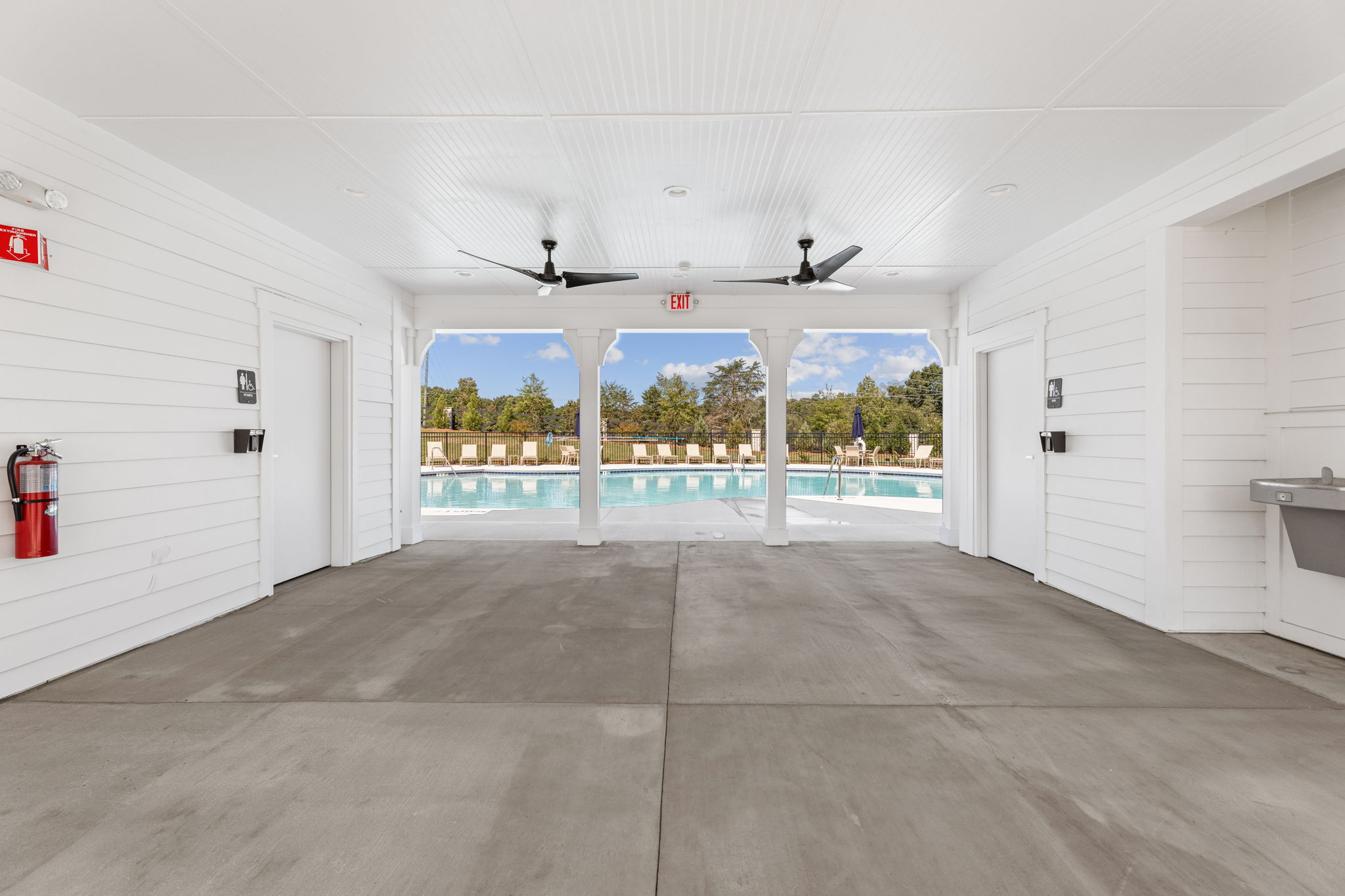A room with white walls and a large window.