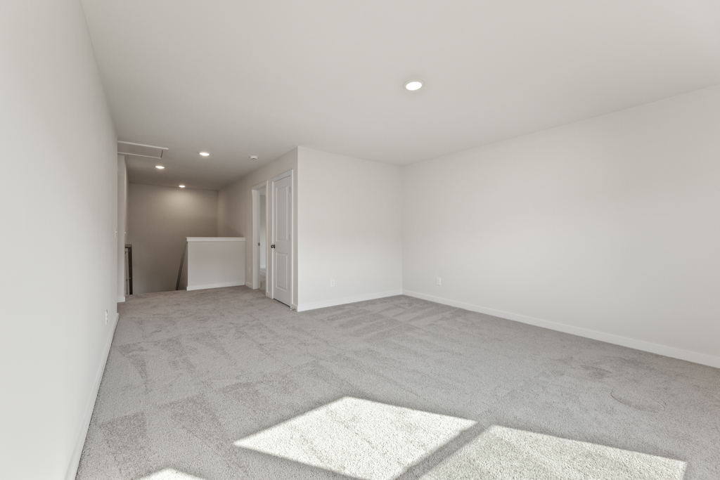 A room with a rug and a rug.