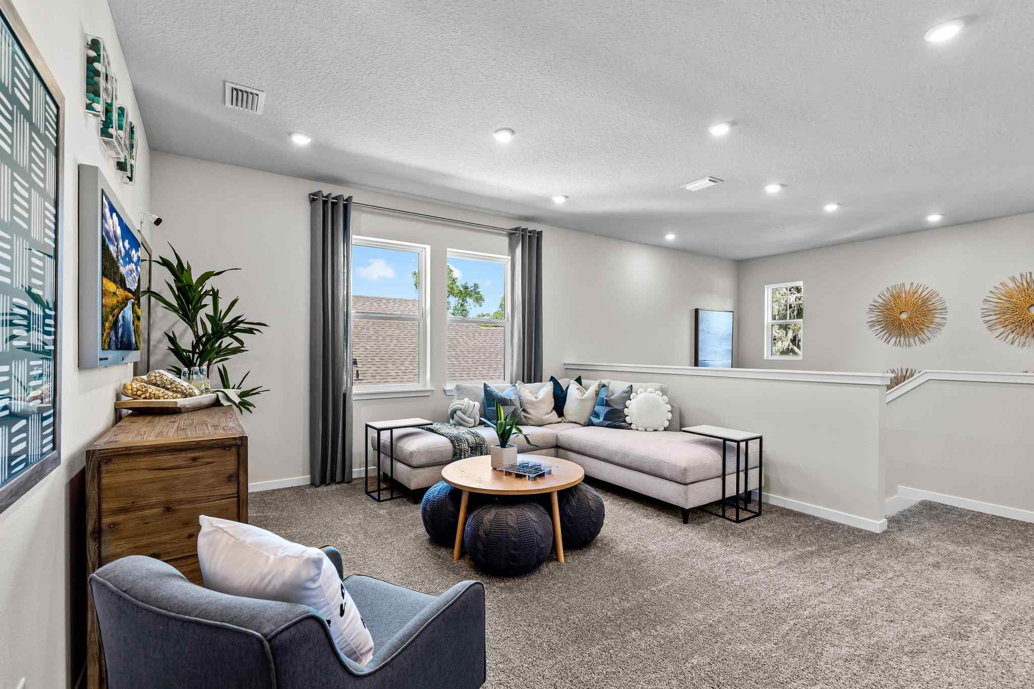 A living room with a couch and a table.