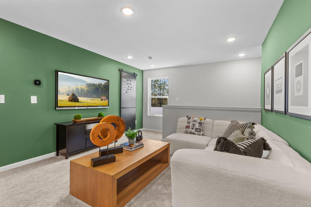 A living room with a couch and a tv.