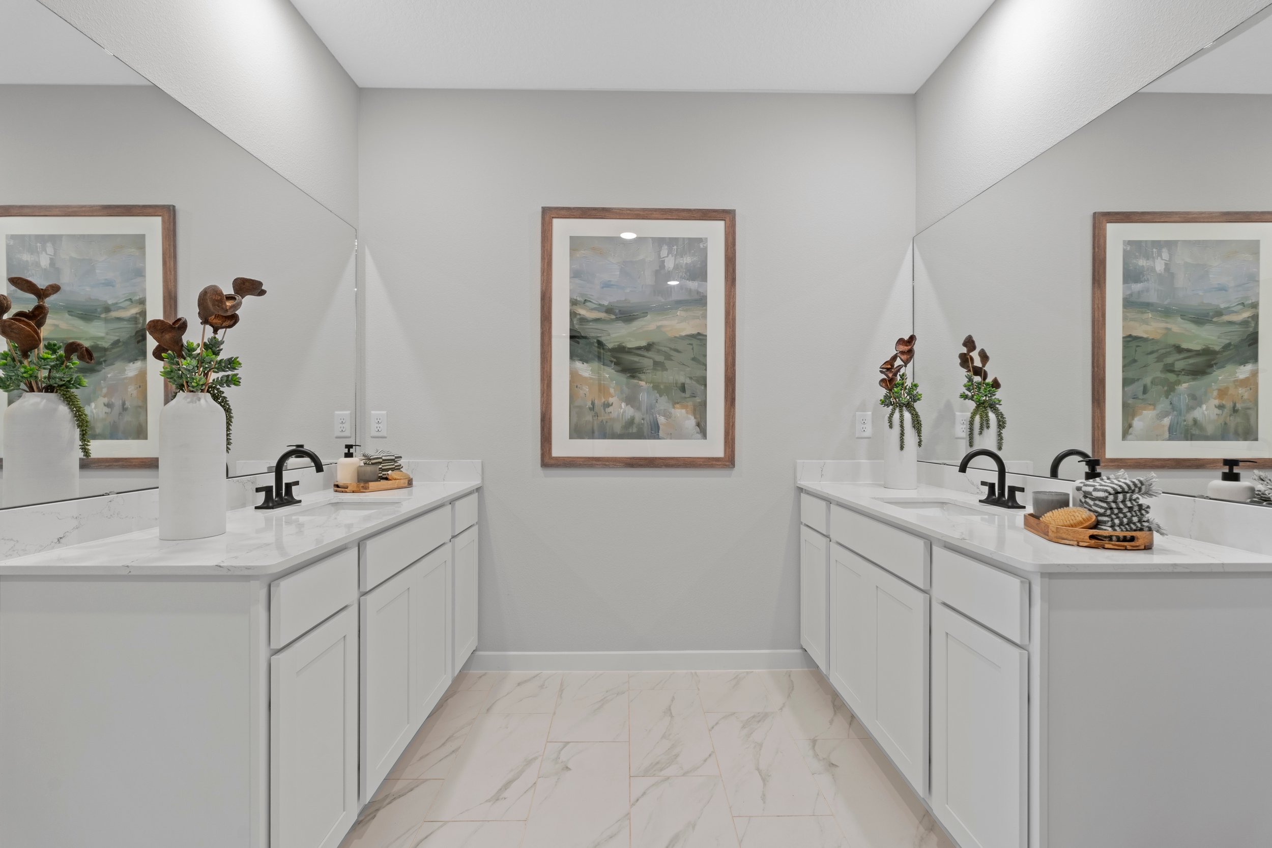 Kenai Model Home Two Primary Bathroom Sink Counters Across From Each Other at Reserve East in Flagler Beach