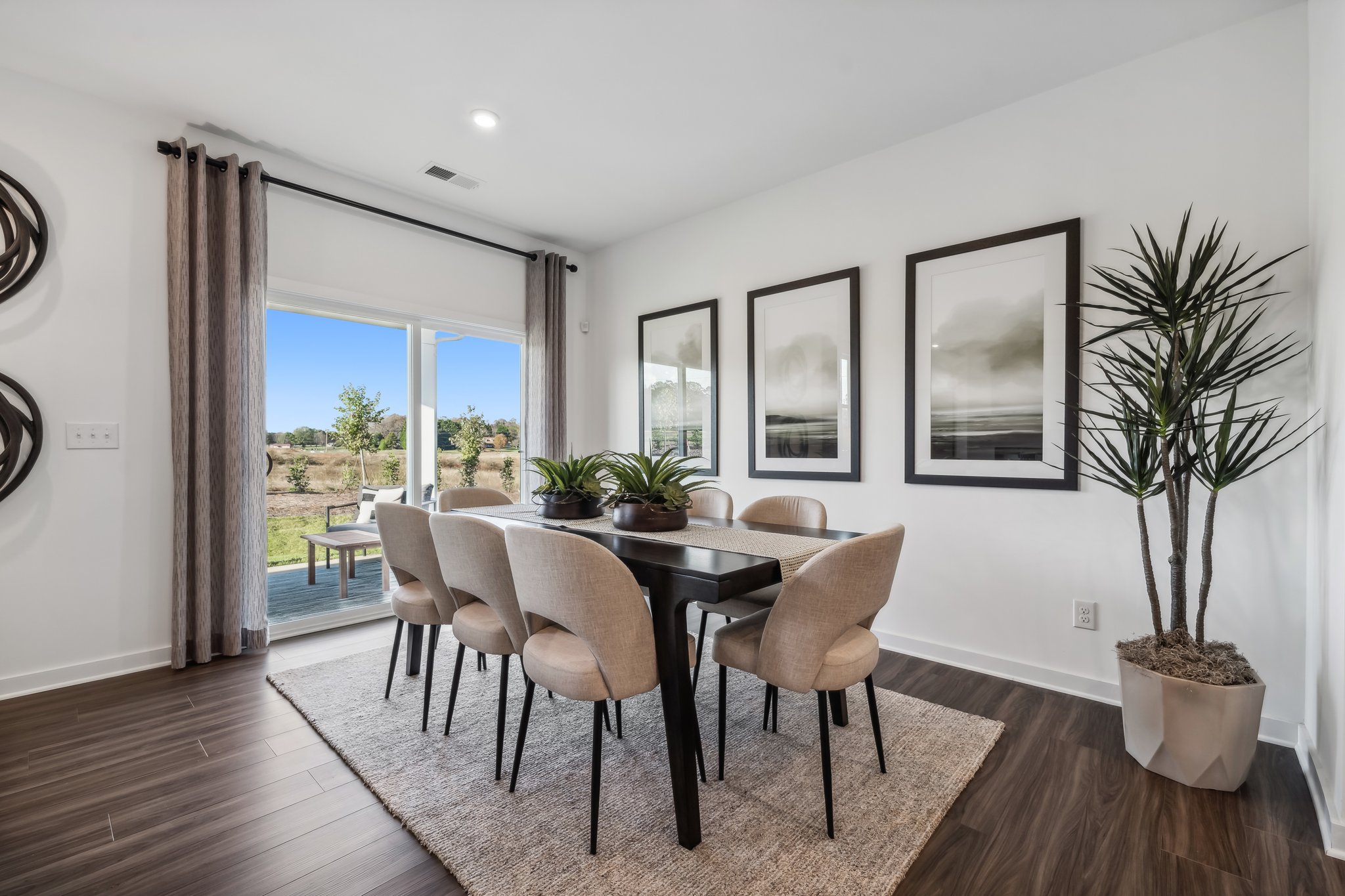 A dining room with a large window.