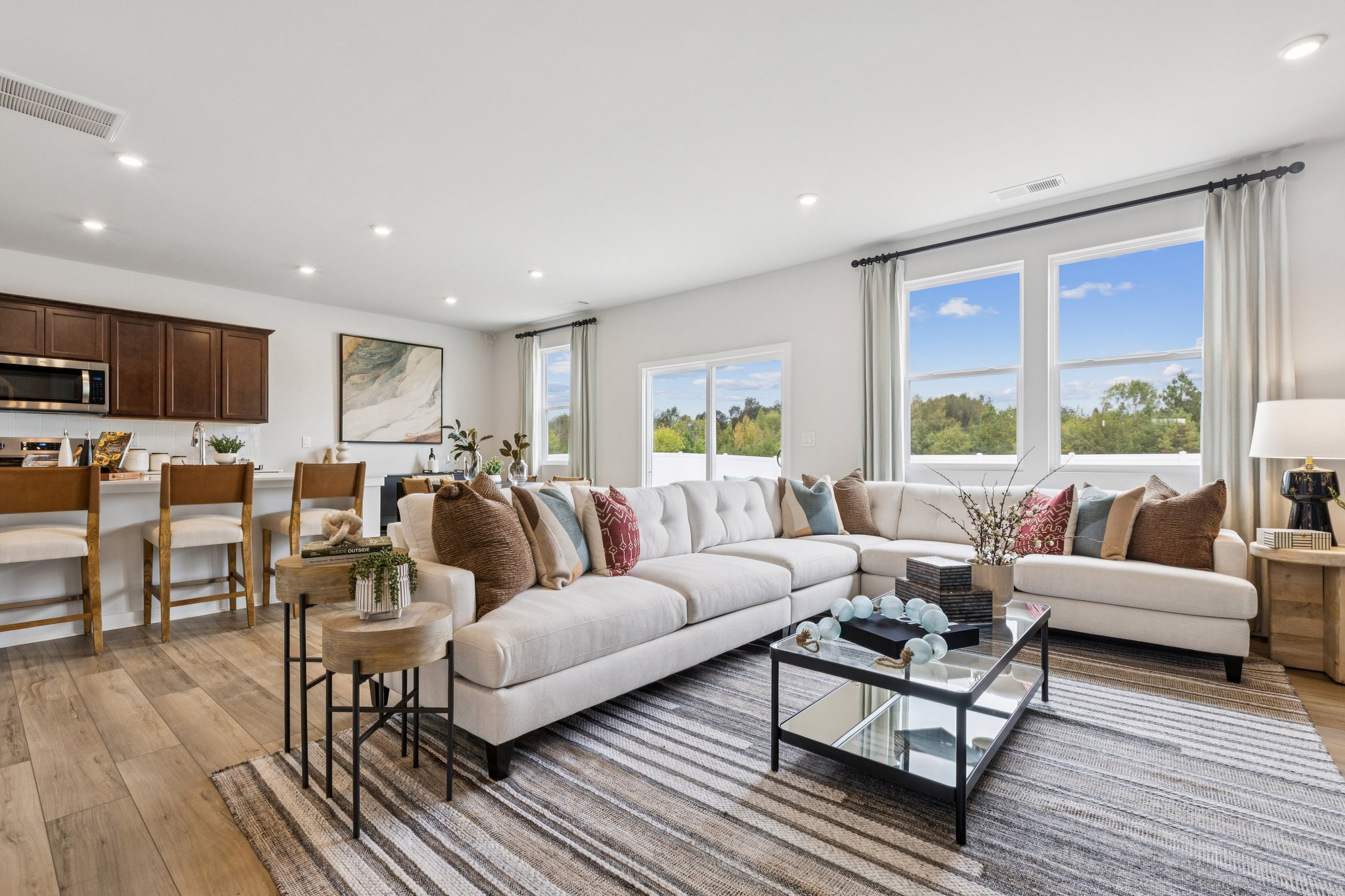 A large living room with a large window.