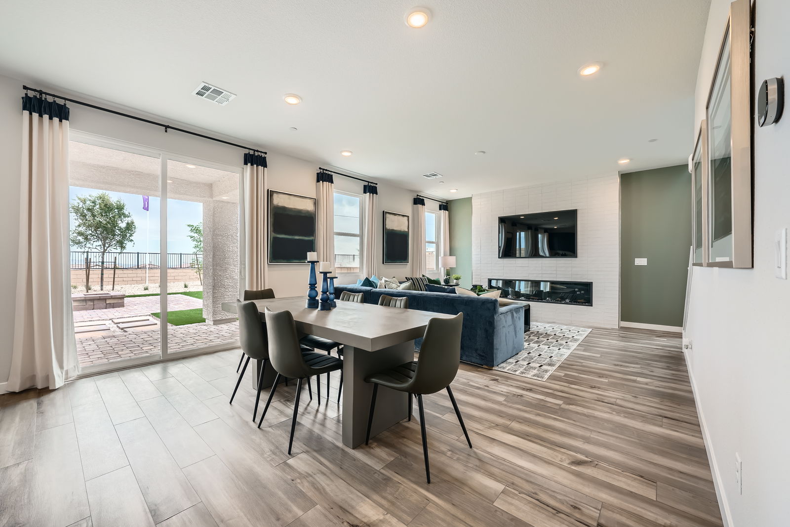 A dining room with a large table.