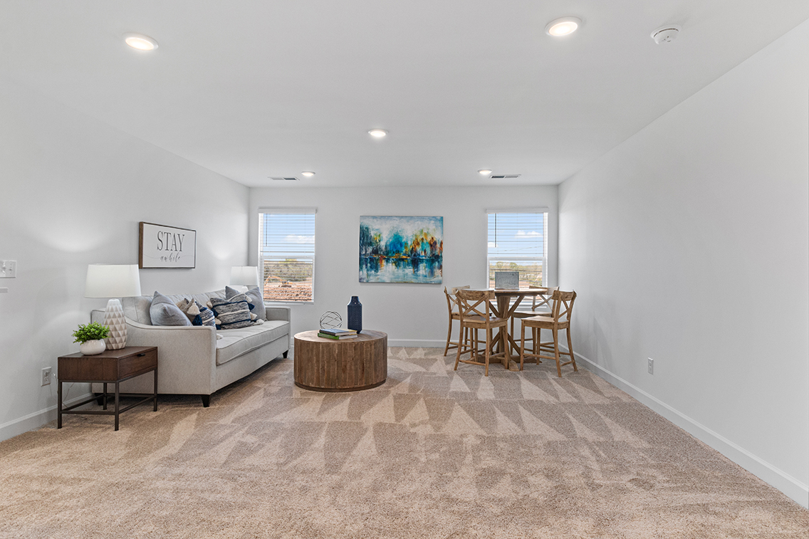 A living room with a couch and a table.