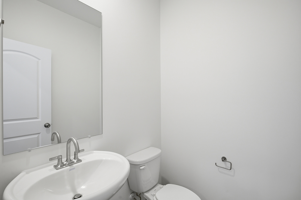 A bathroom with a sink and toilet.