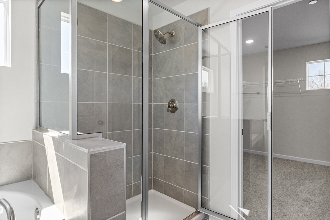 A bathroom with a glass shower.