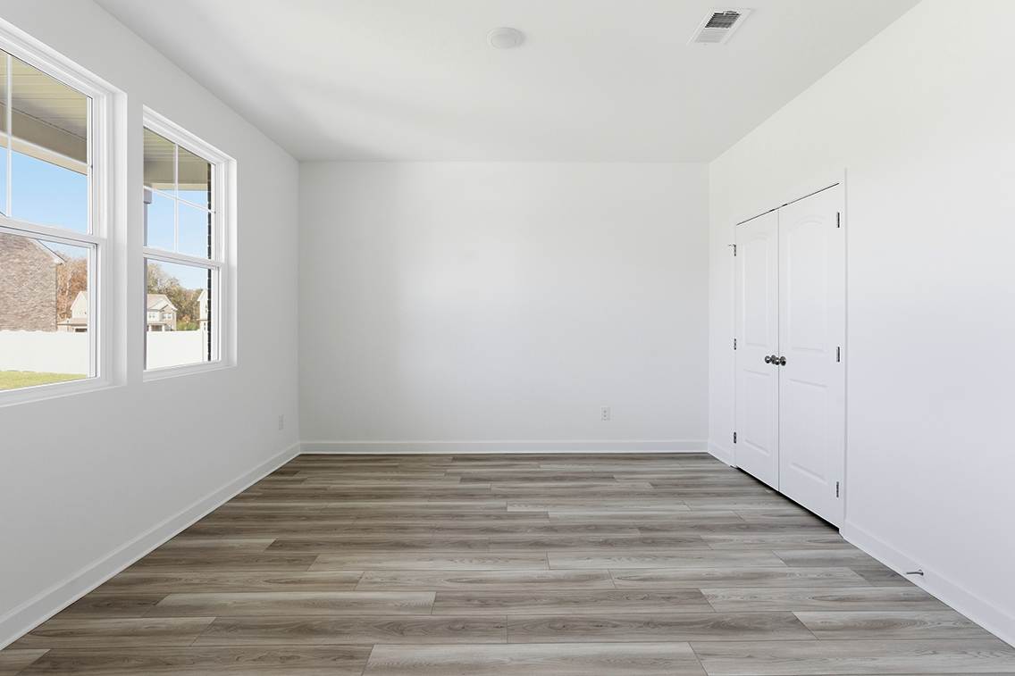 A room with white walls and windows.
