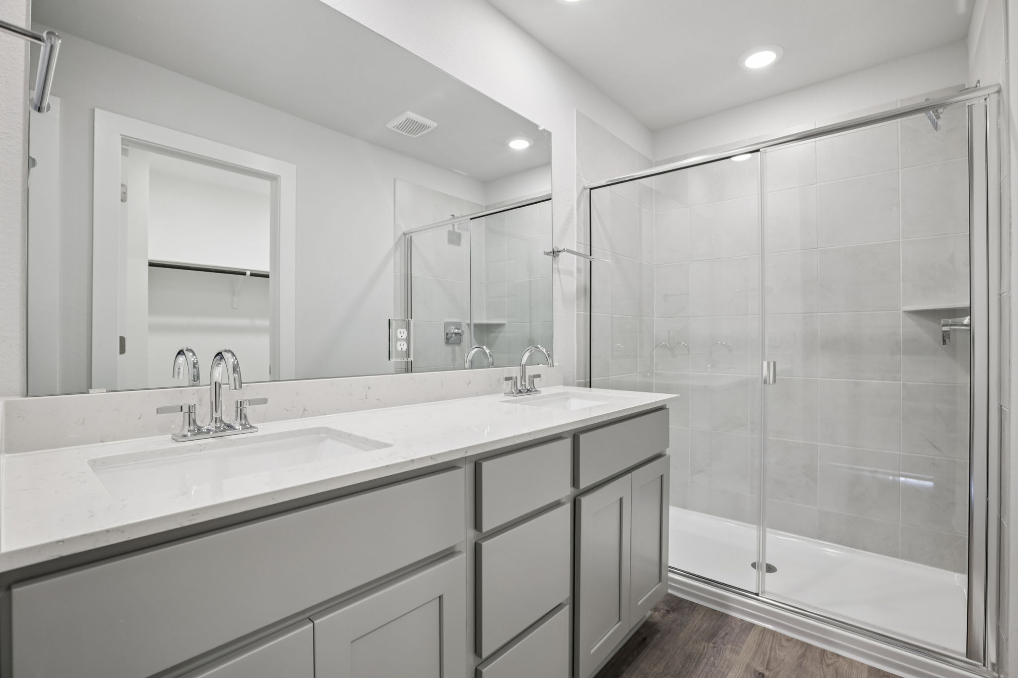 A bathroom with a glass shower.