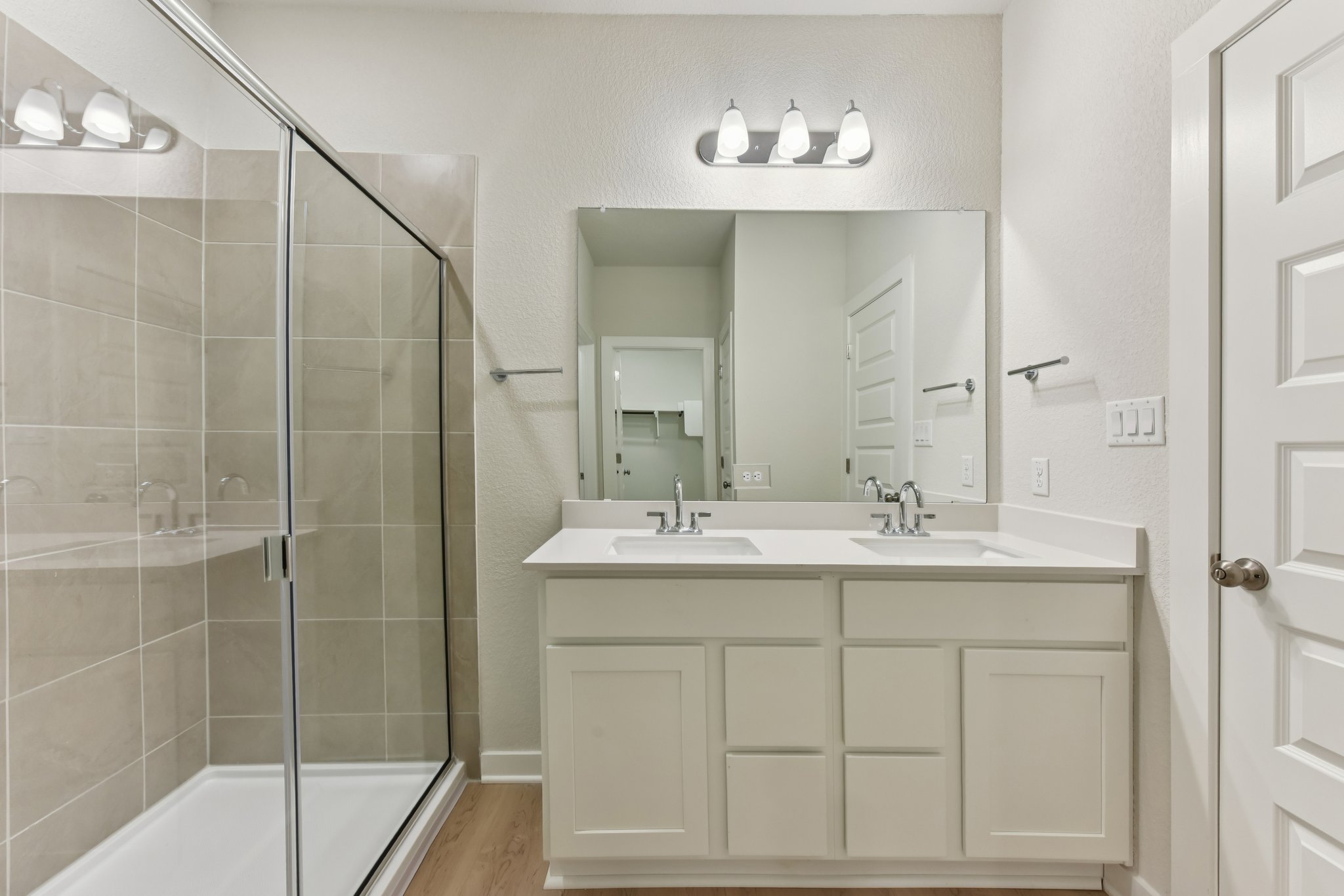 A bathroom with a glass shower.