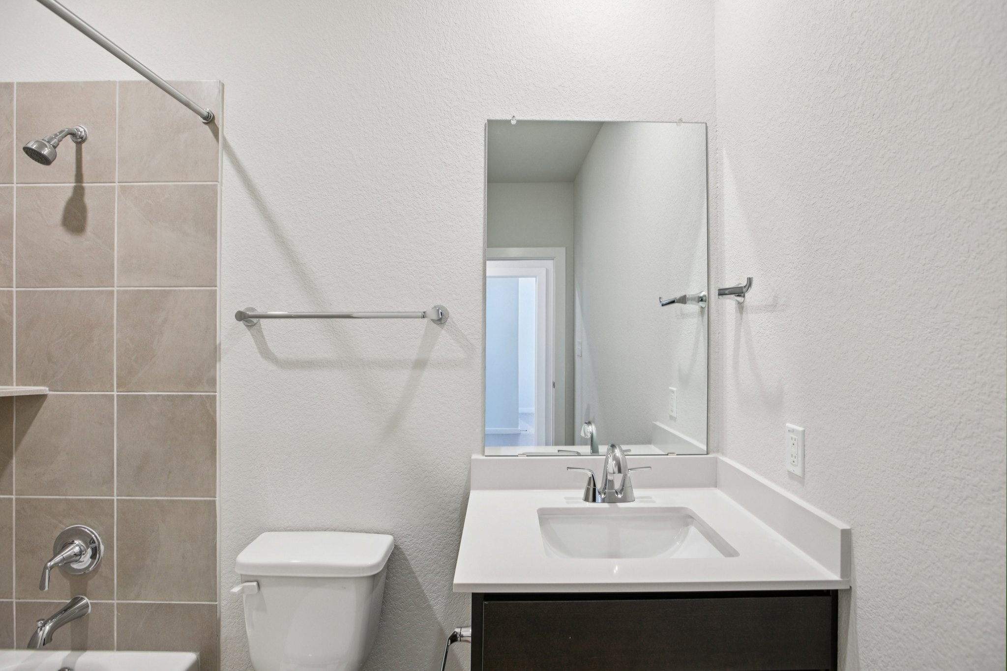 A bathroom with a sink and a toilet.