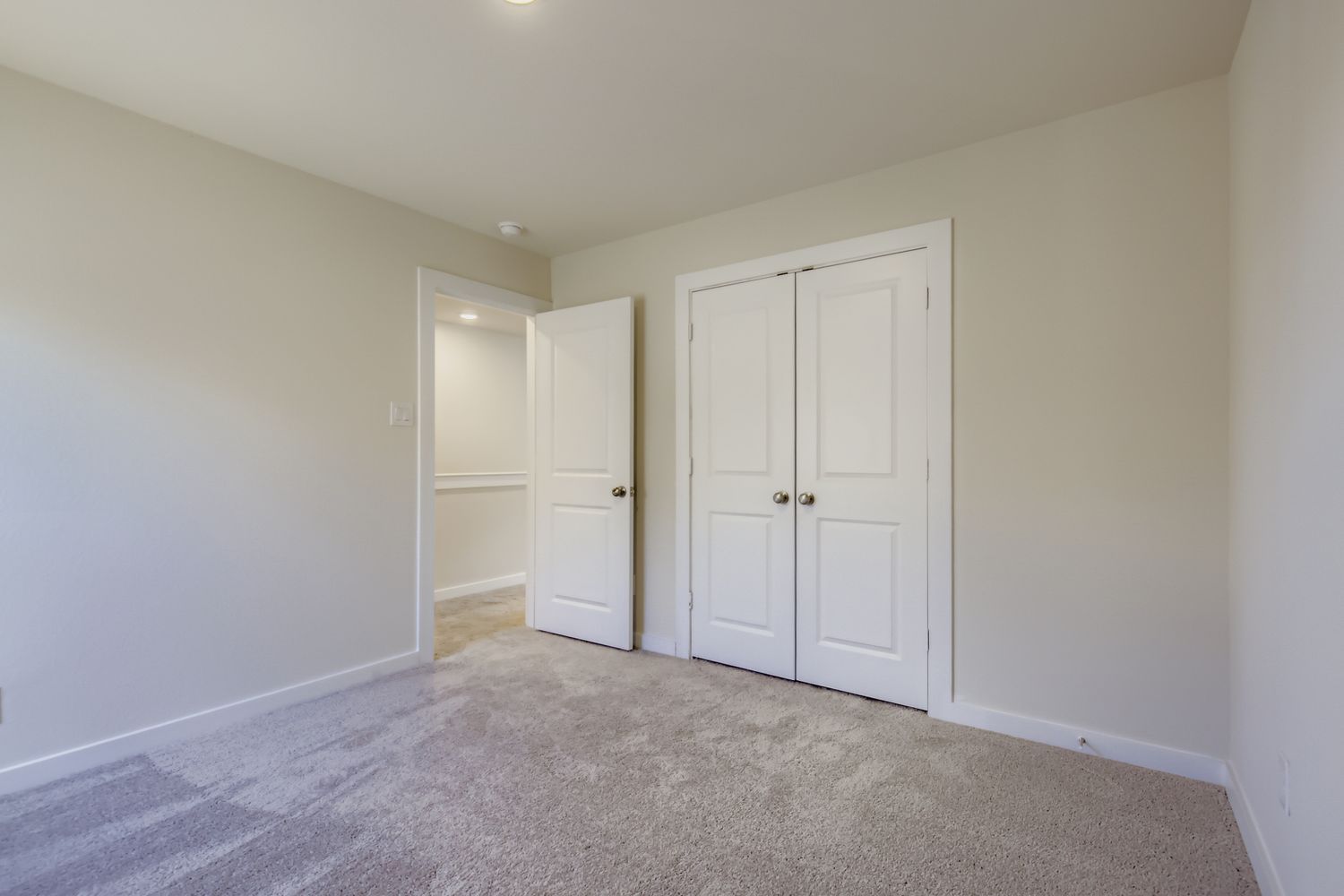 A room with white doors.