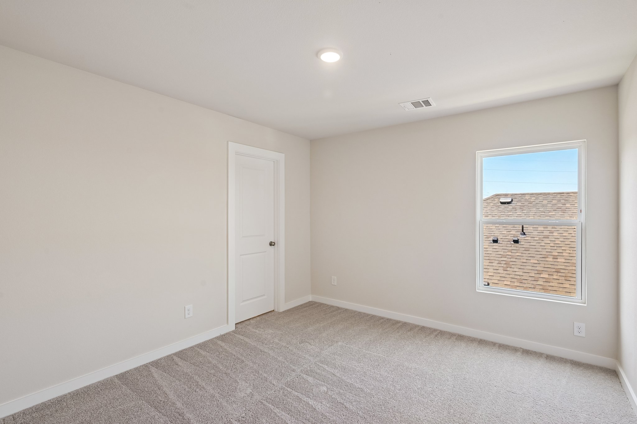 A room with a door and a window.