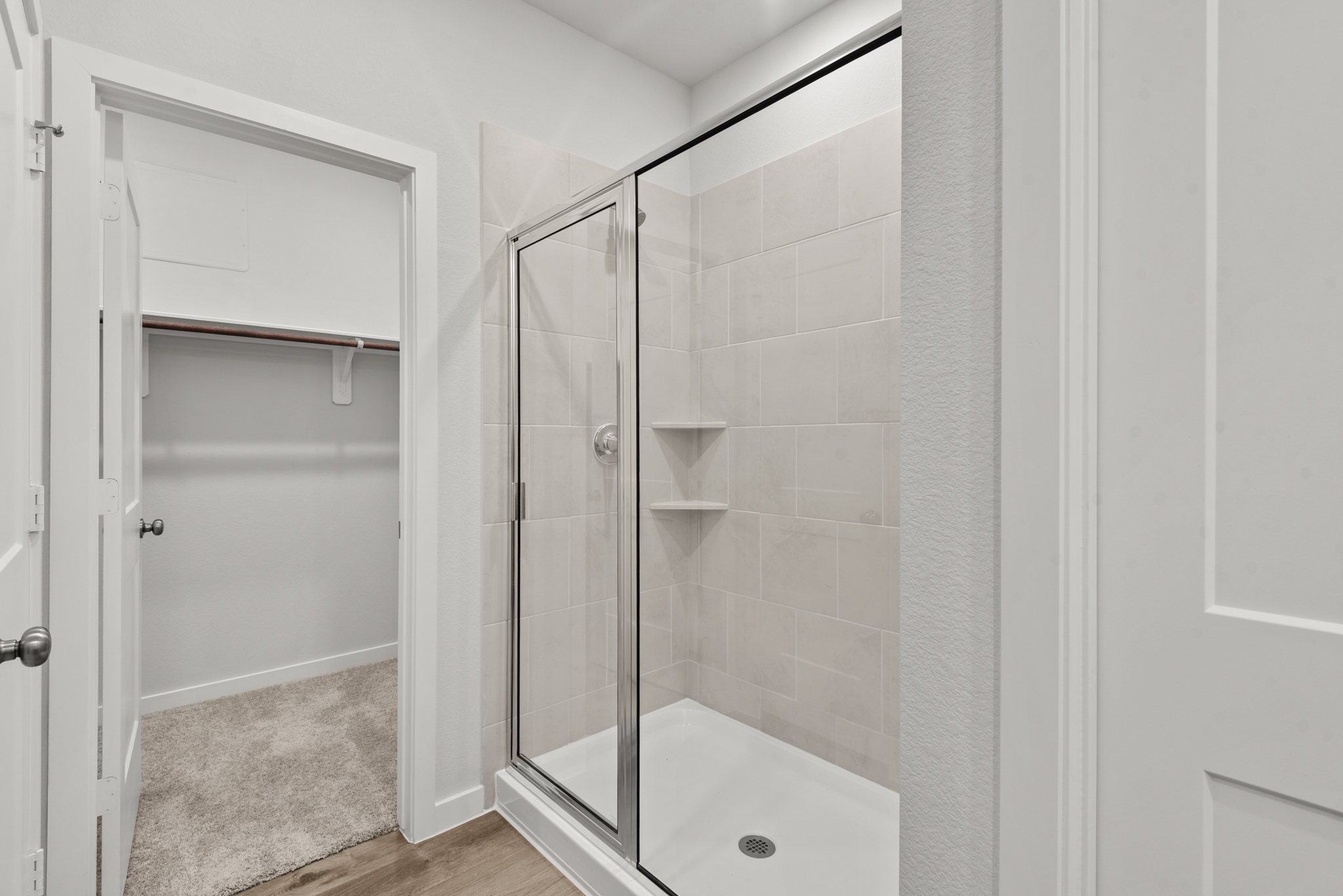 A bathroom with a glass shower.