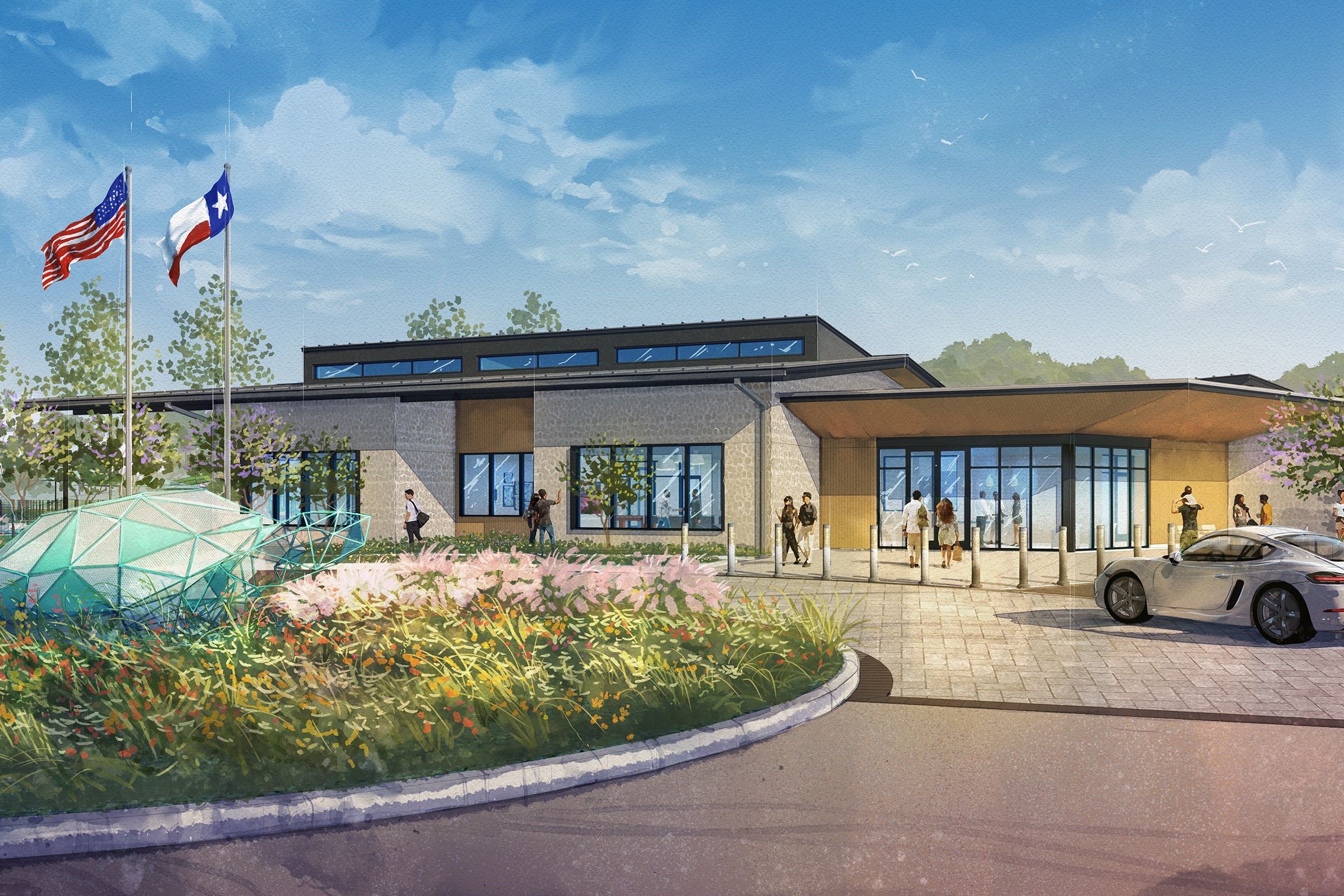 A building with a large flower bed and a car parked in front.