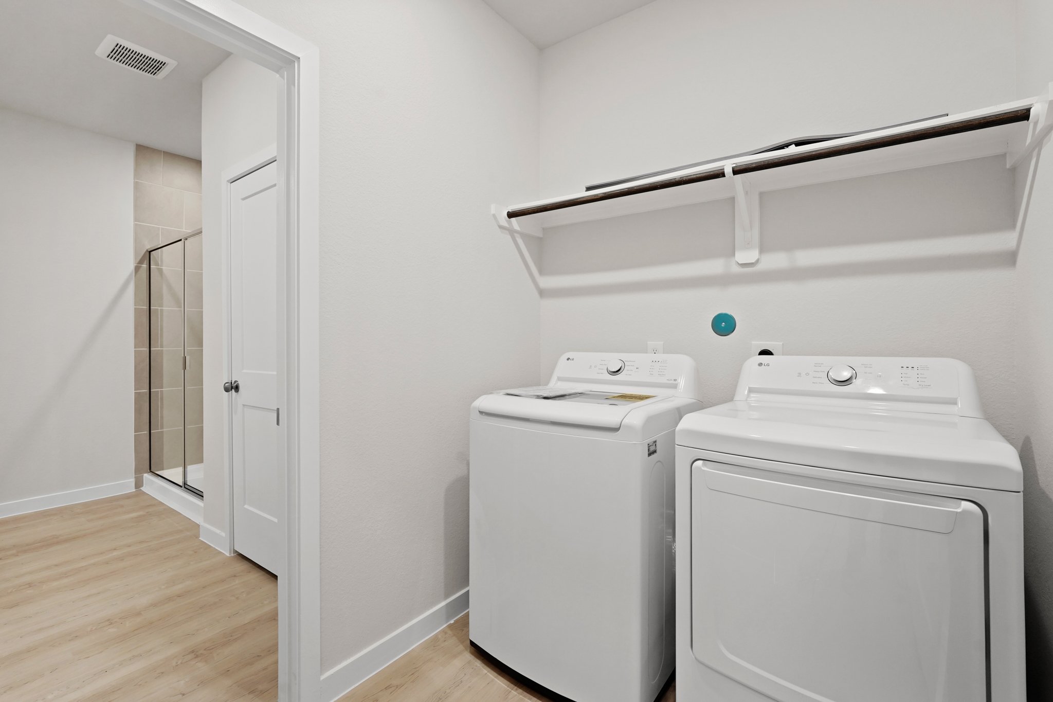 A laundry room with a washer and dryer.