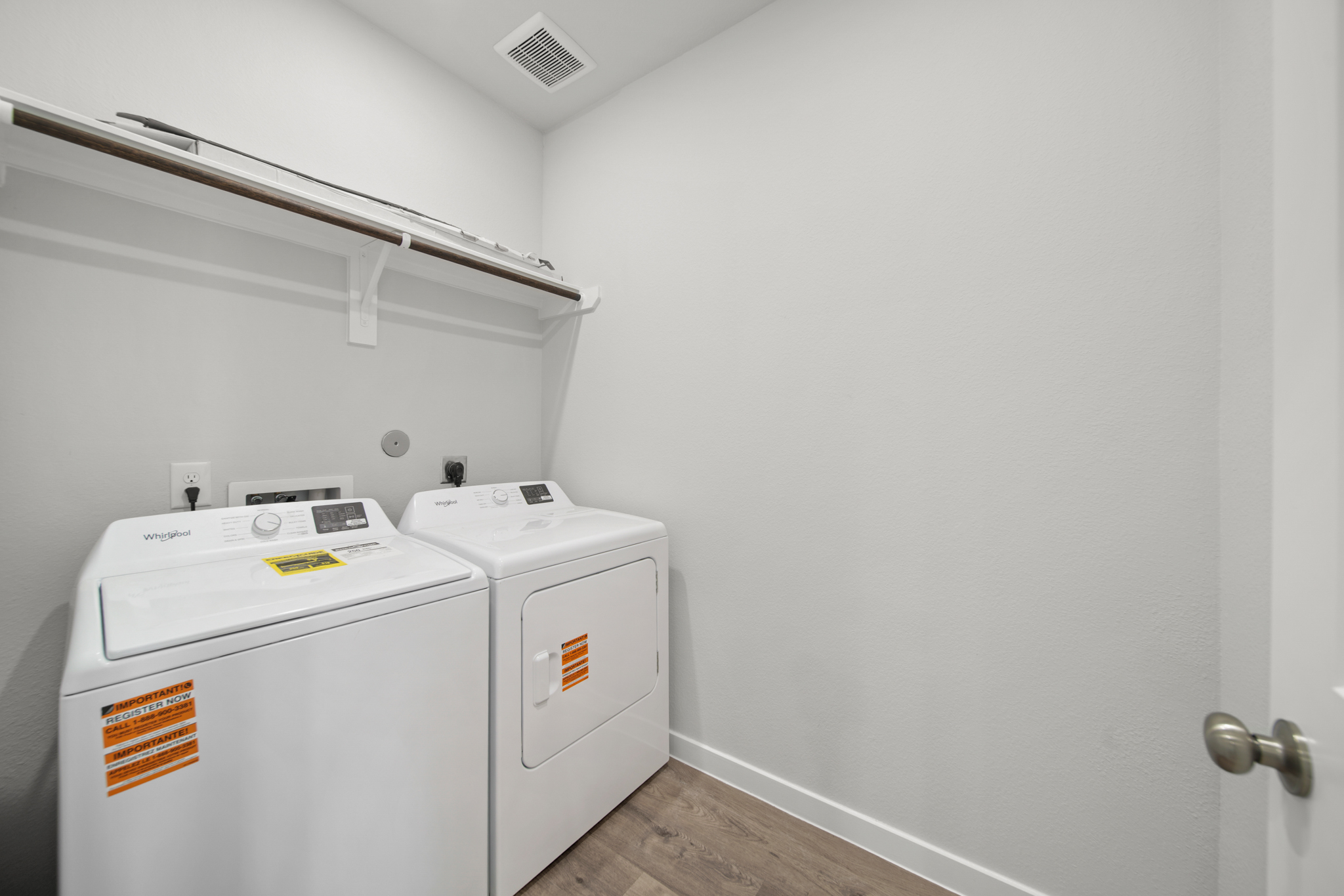 A washing machine in a room.