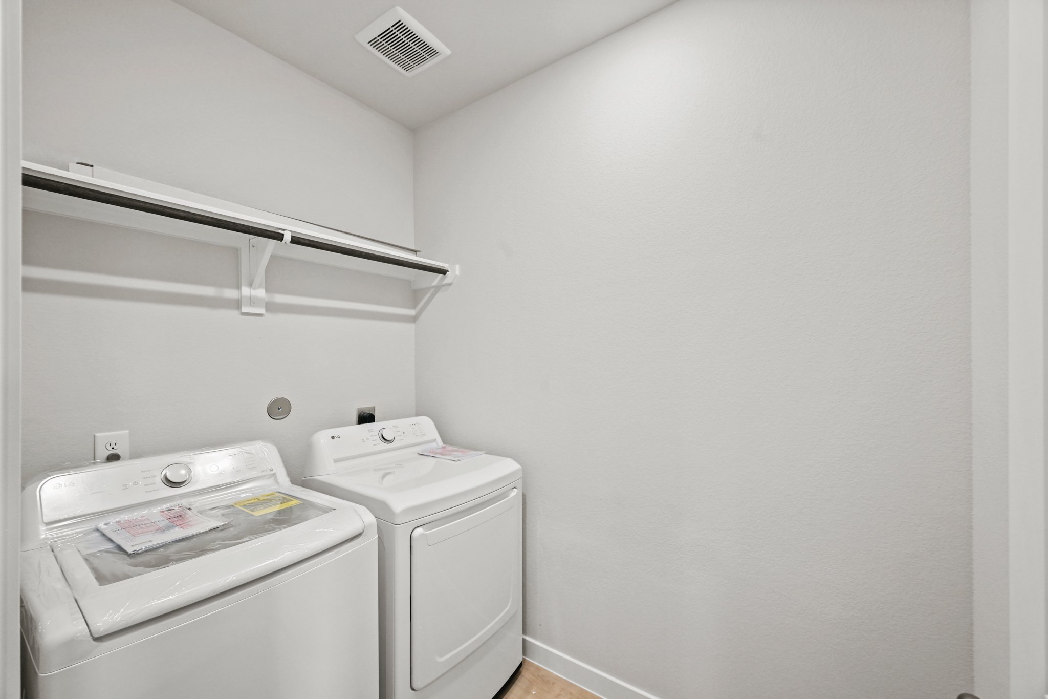 A washing machine in a room.