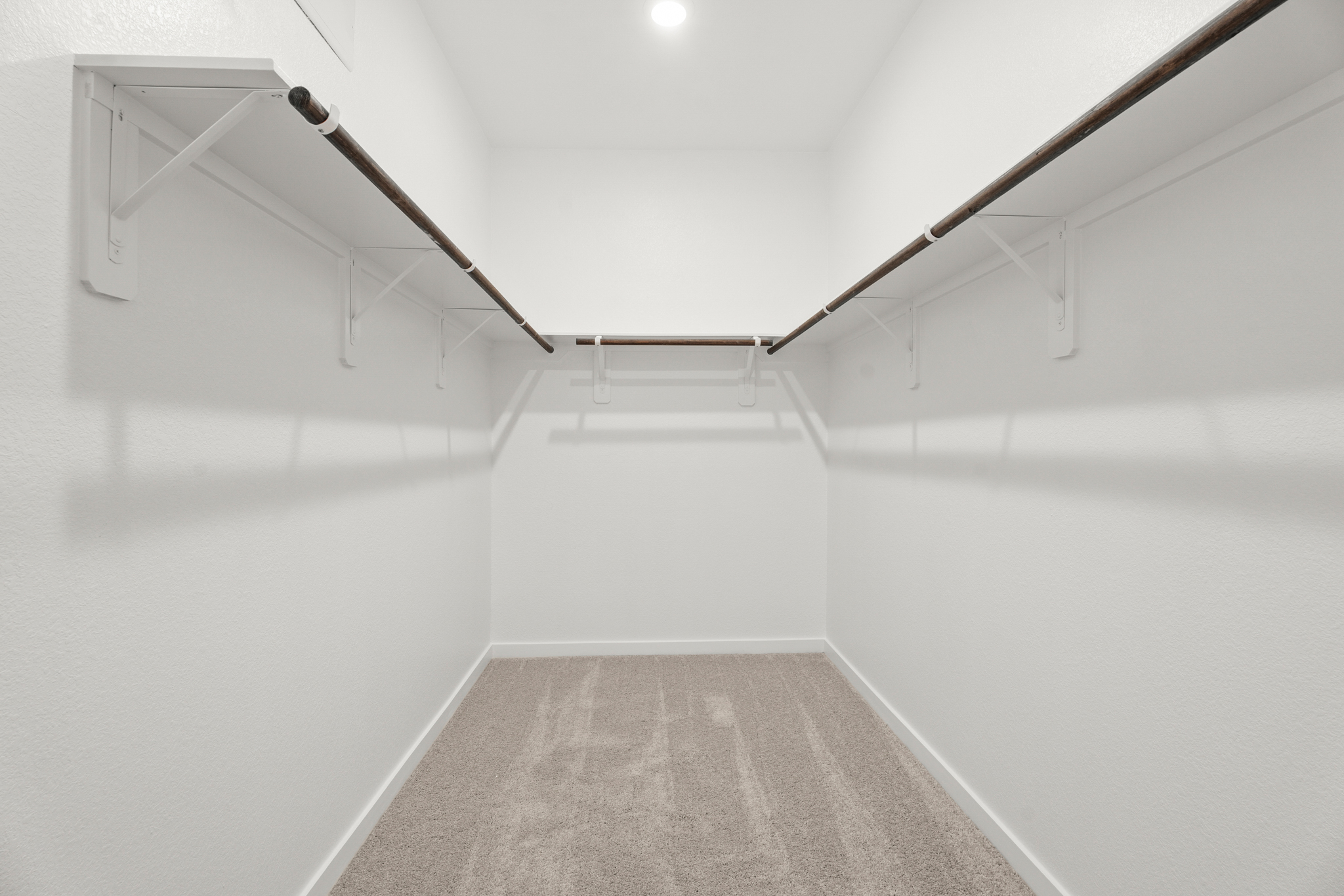 A white room with a staircase.