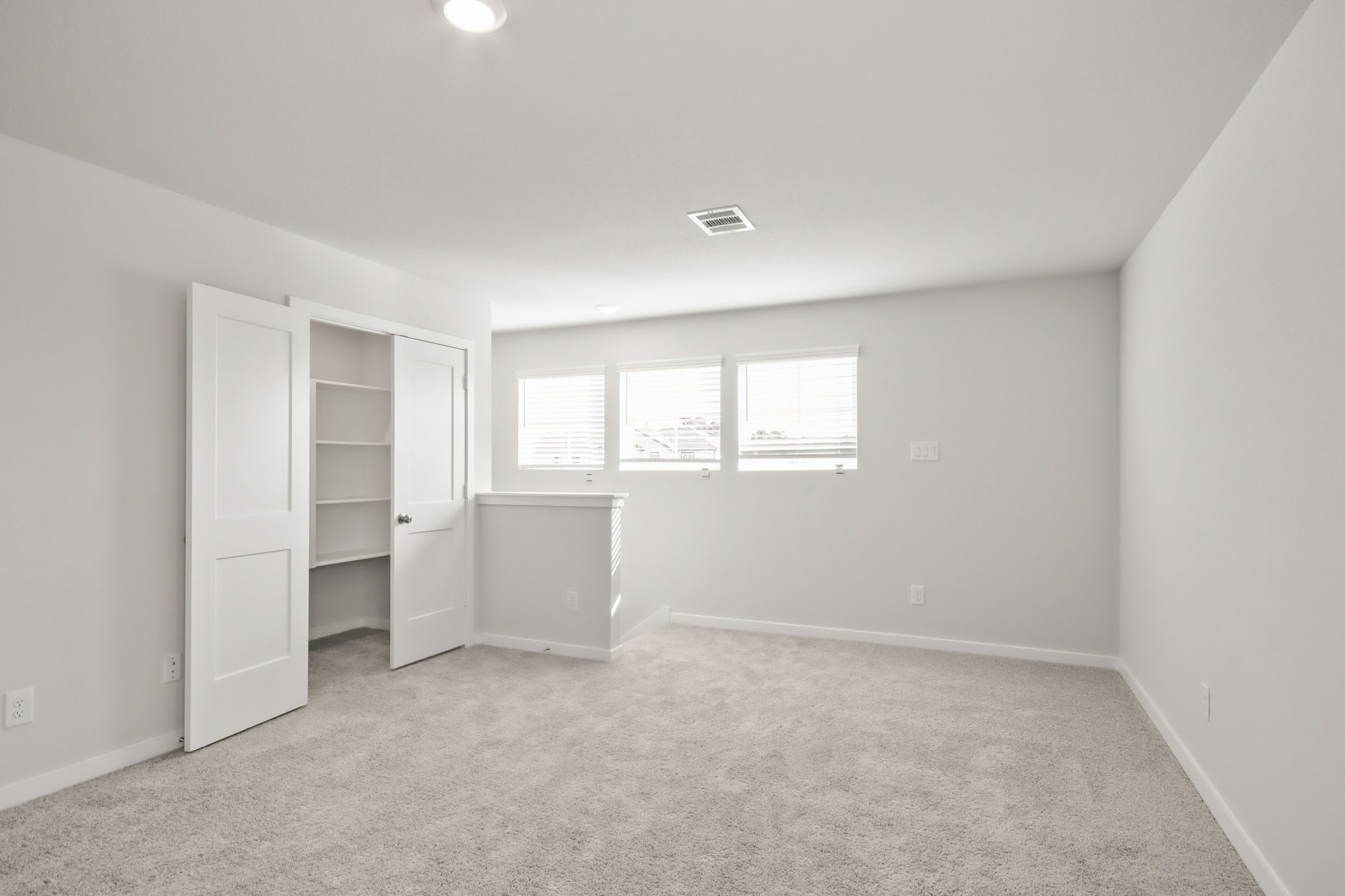 A room with white cabinets.