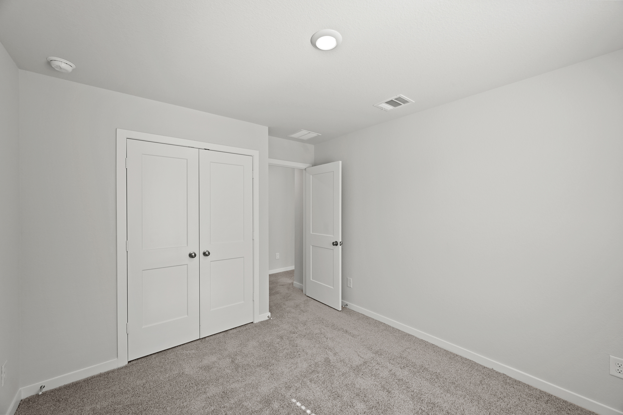 A room with white doors.