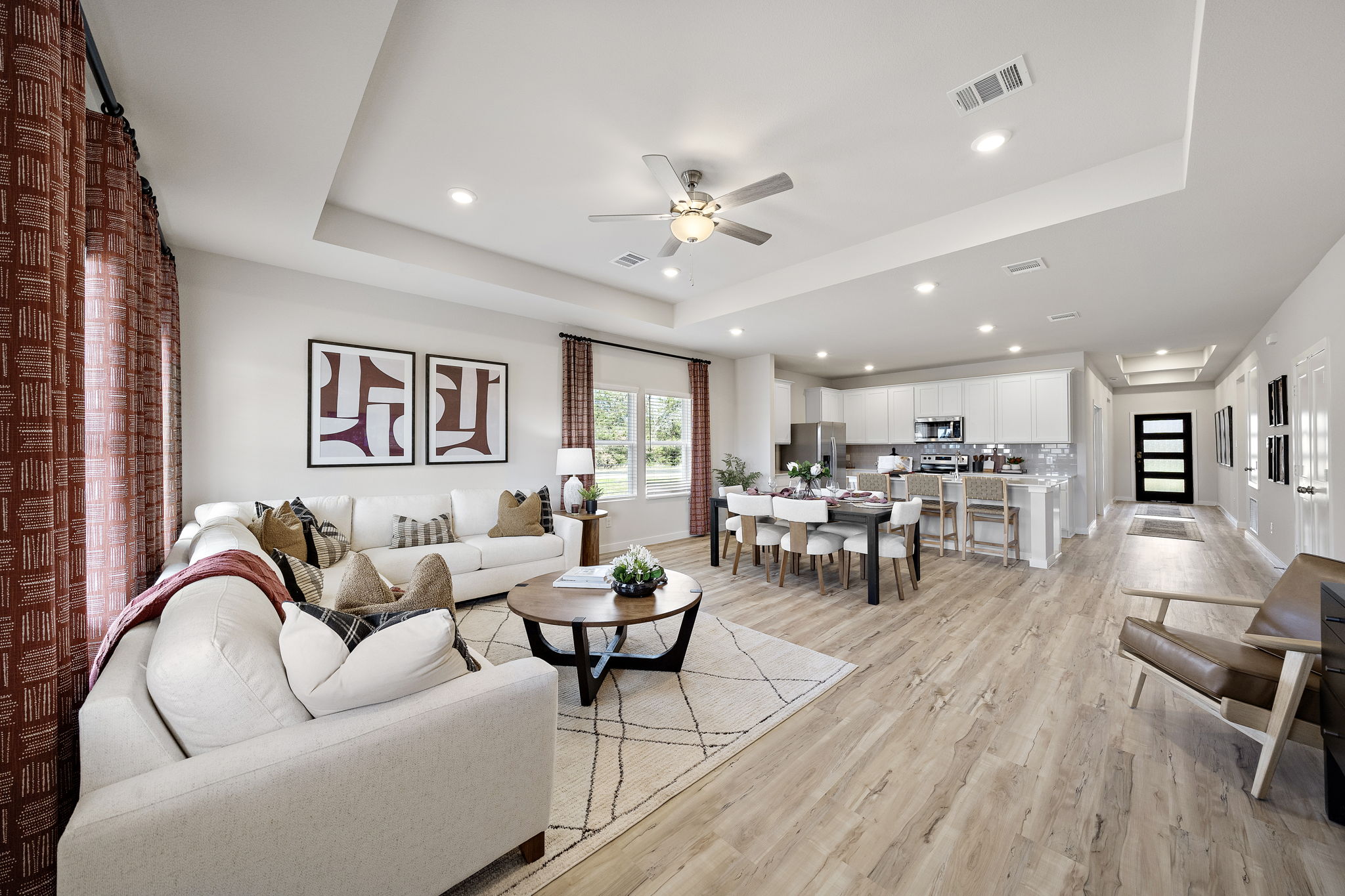 A living room with a wood floor.