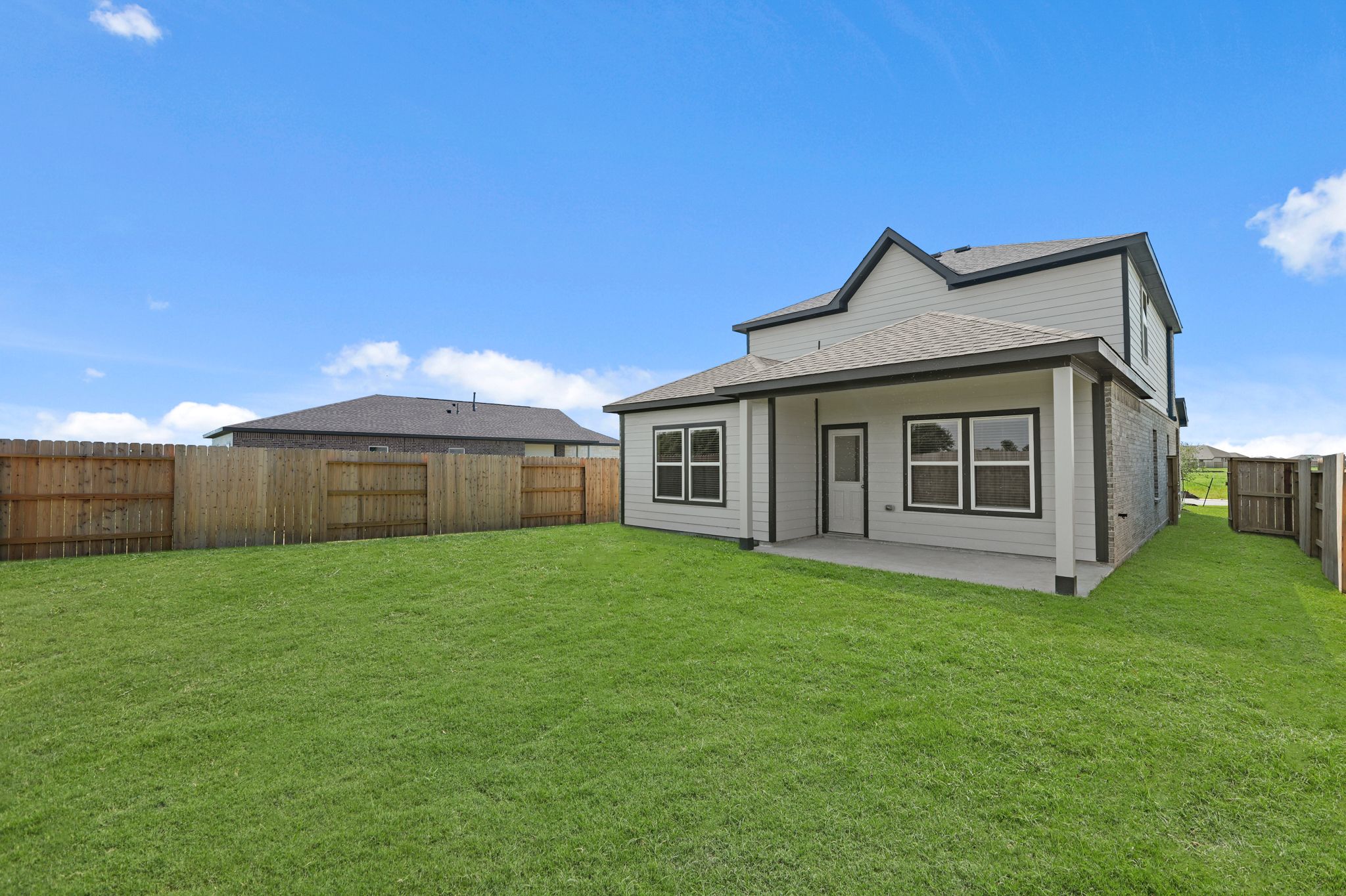 A house in a grassy field.