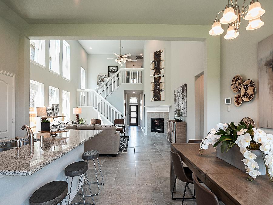 A kitchen with a fireplace and dining area.
