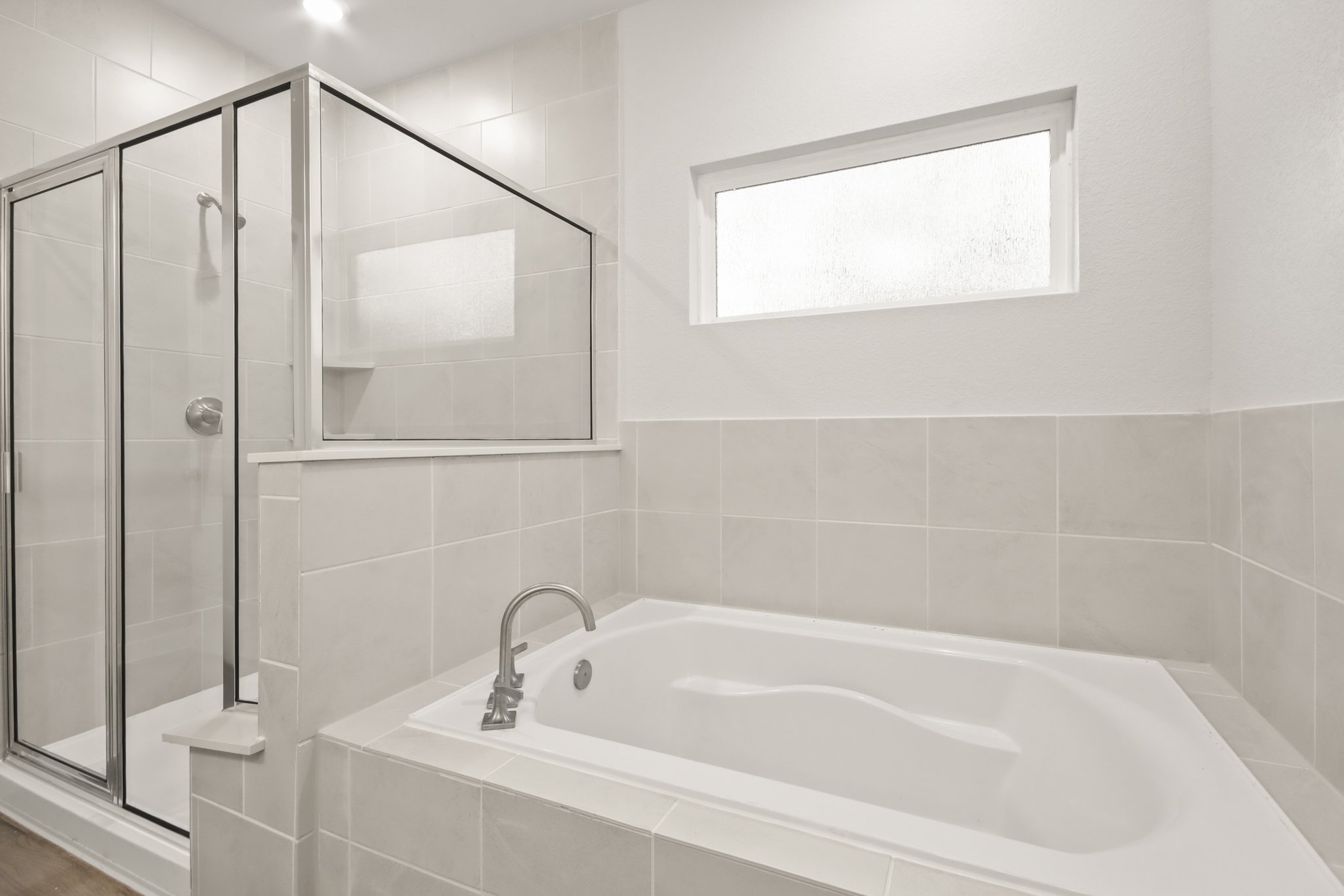 A bathroom with a glass shower.